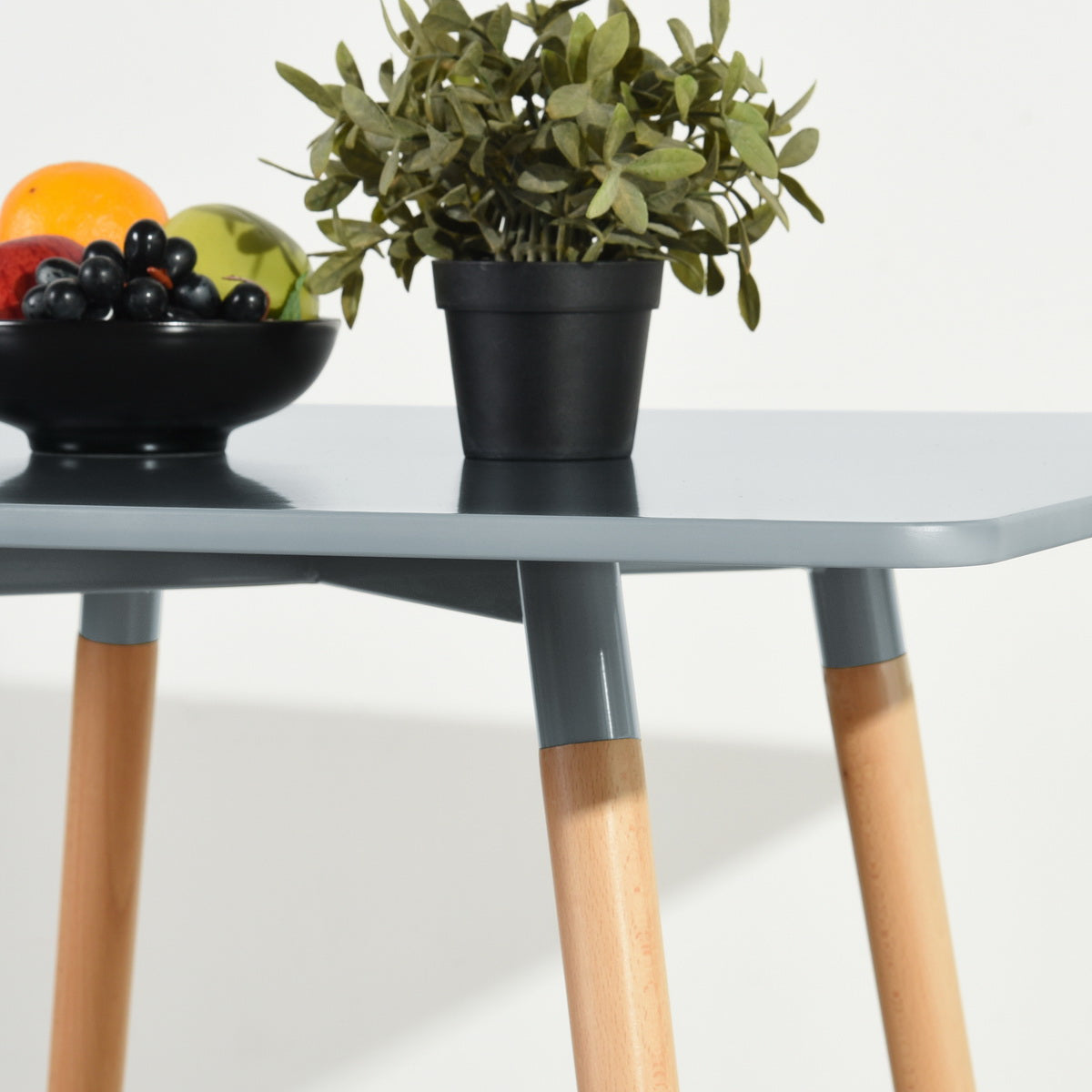 Rookie modern dining table - available in black, white, or grey with rubberwood legs