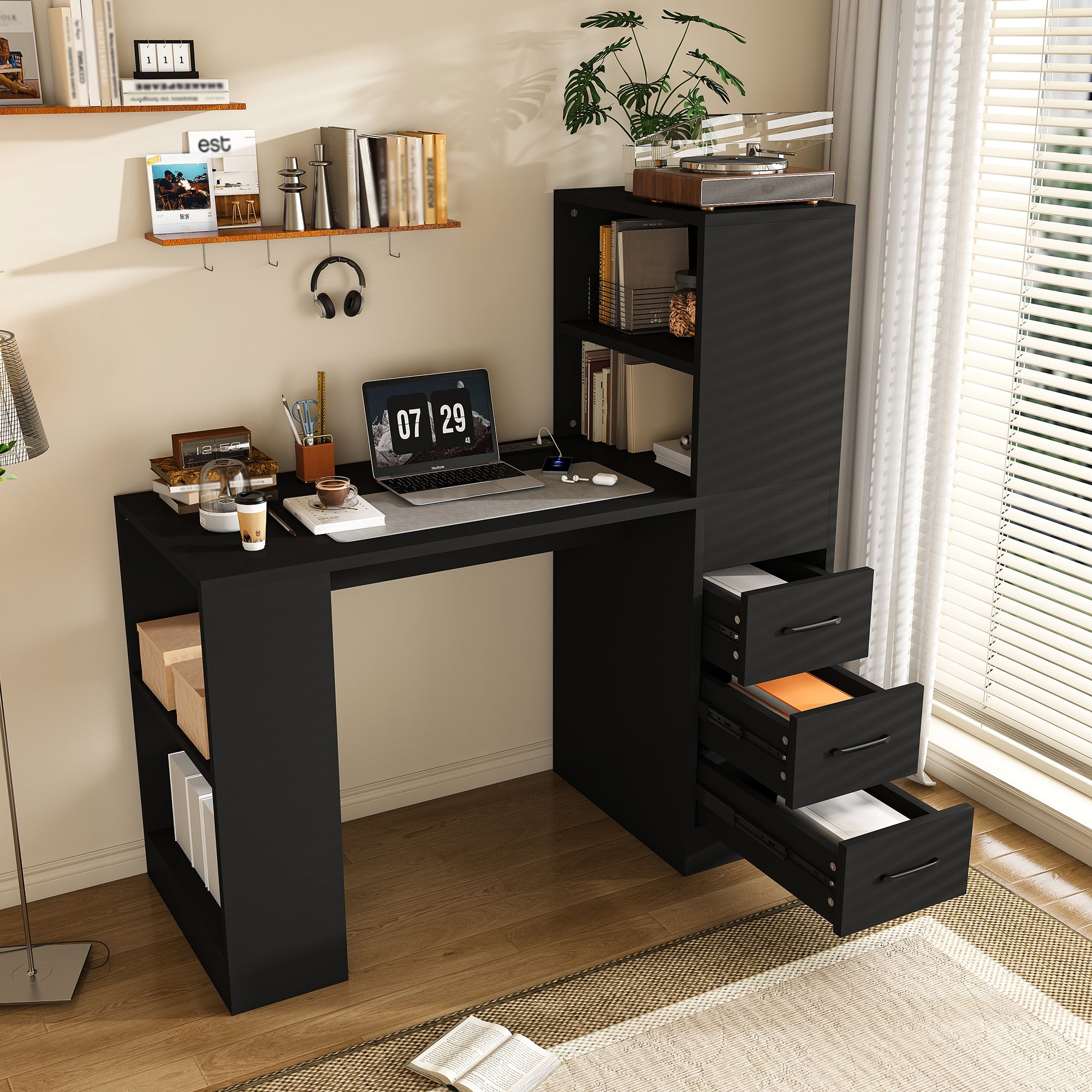 Aalto black computer desk showing a hutch, open shelves and three drawers in a bright home office