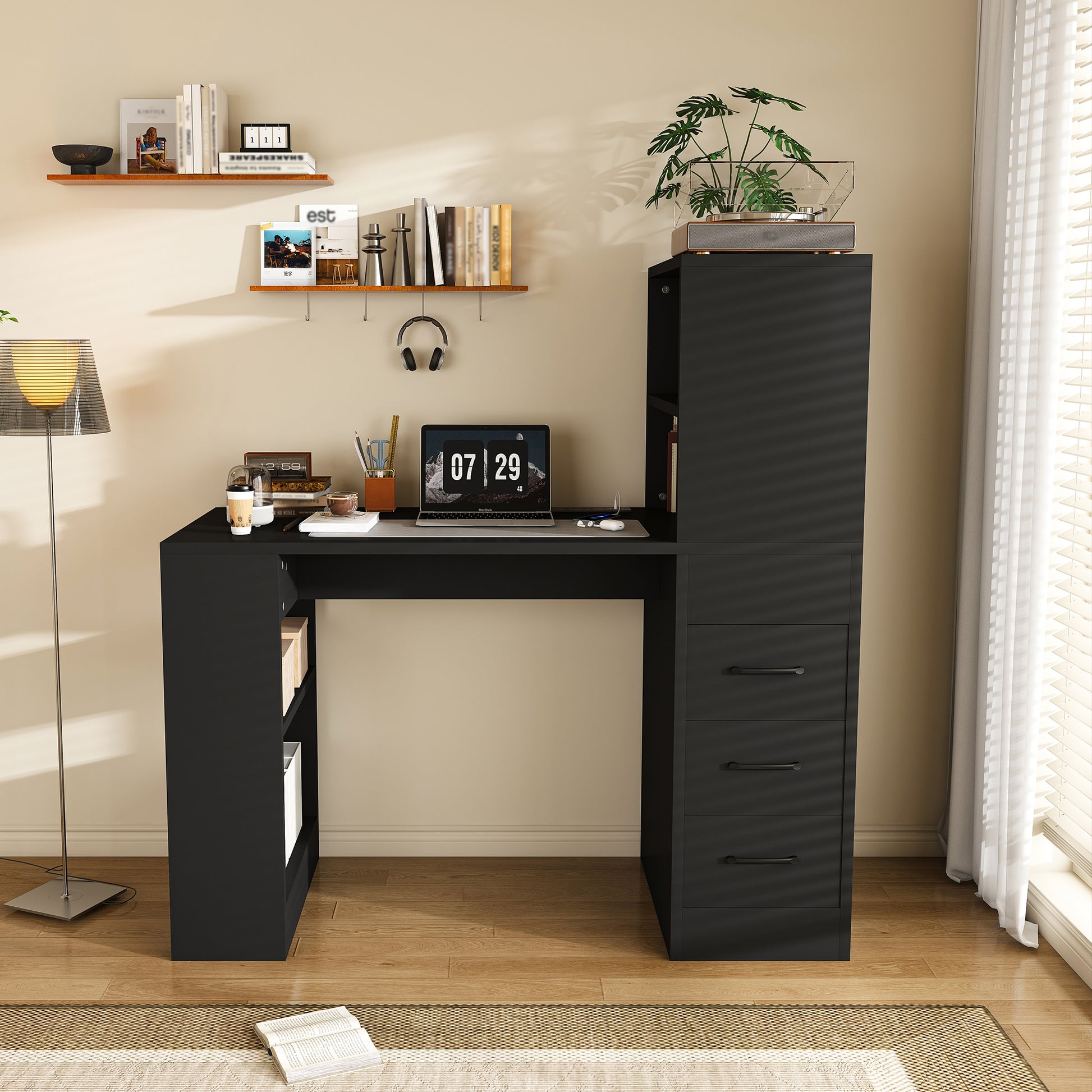 Aalto black computer desk showing open shelves and three drawers in a bright neutral workspace