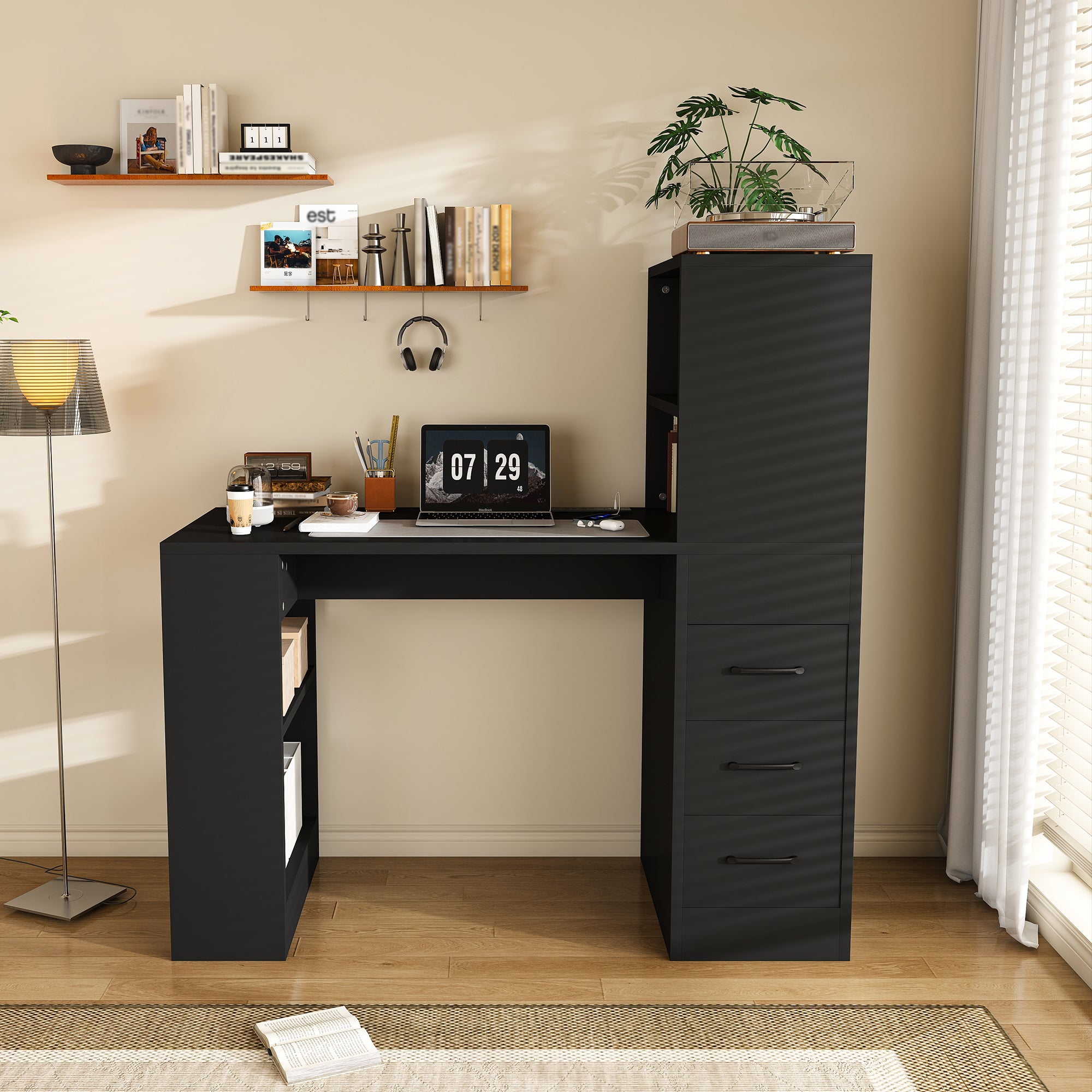 Aalto black computer desk showing open shelves and three drawers in a bright neutral workspace