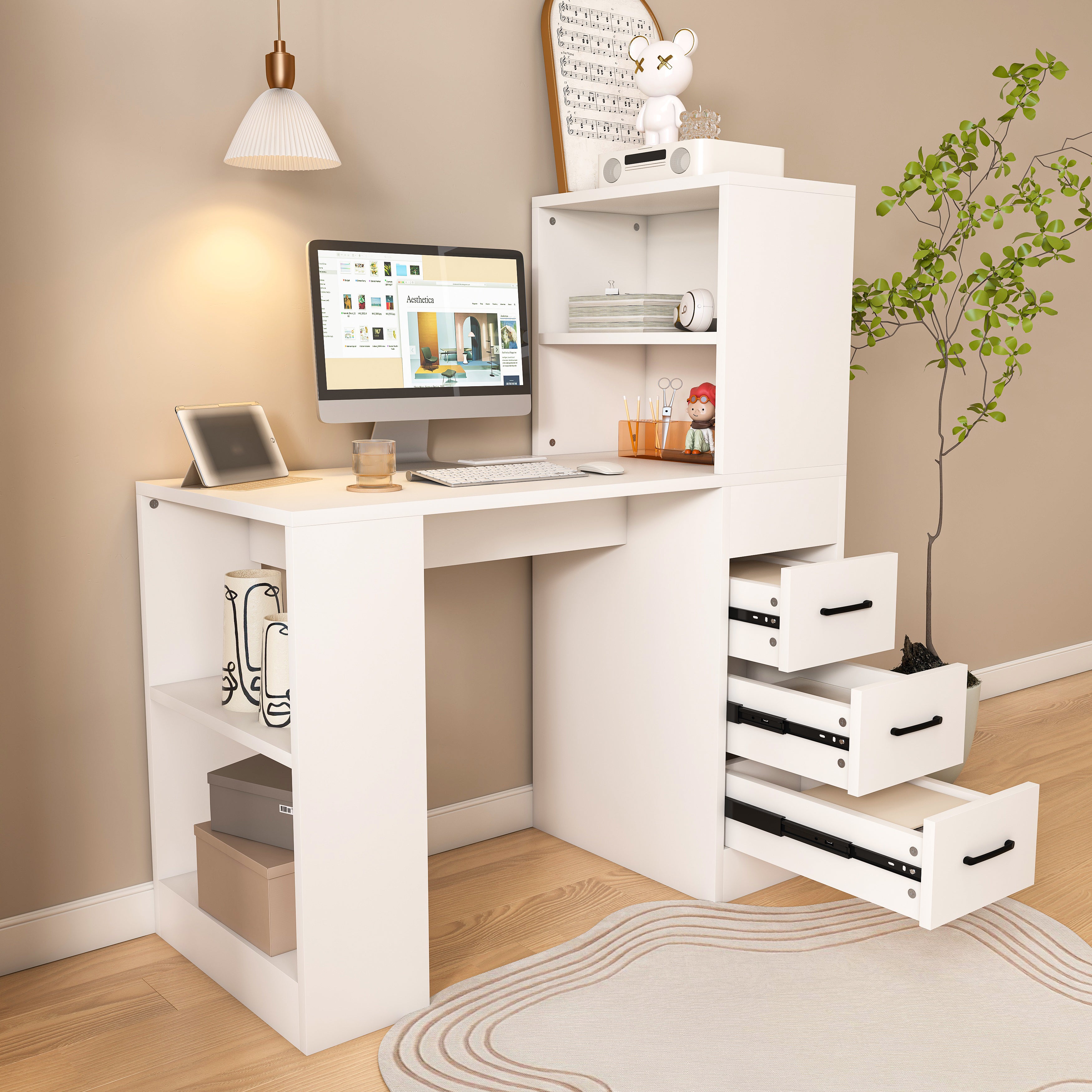 Aalto white computer desk showing a compact workspace with storage shelves and open drawers