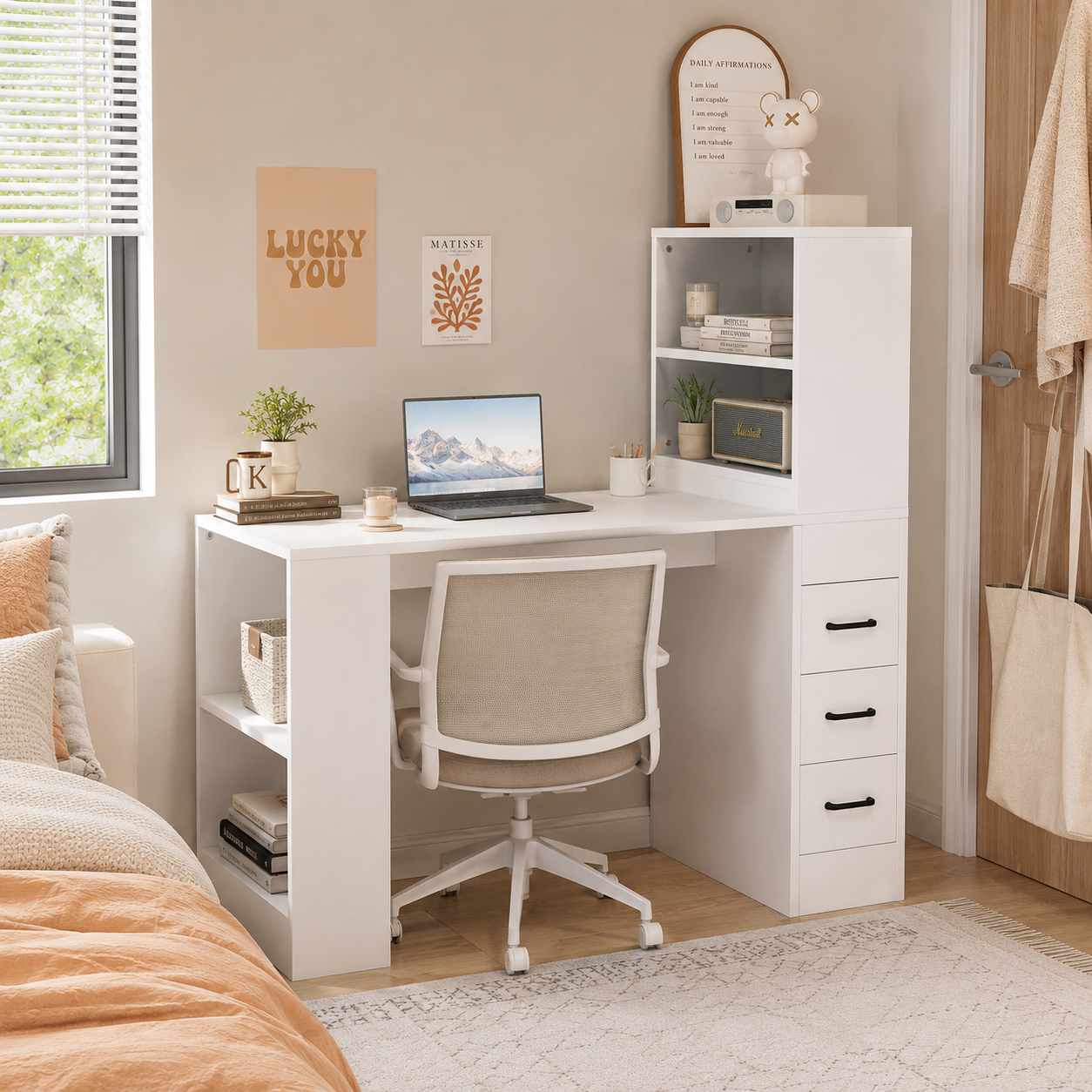 Aalto white computer desk showing a compact study area with a chair beside a bright window