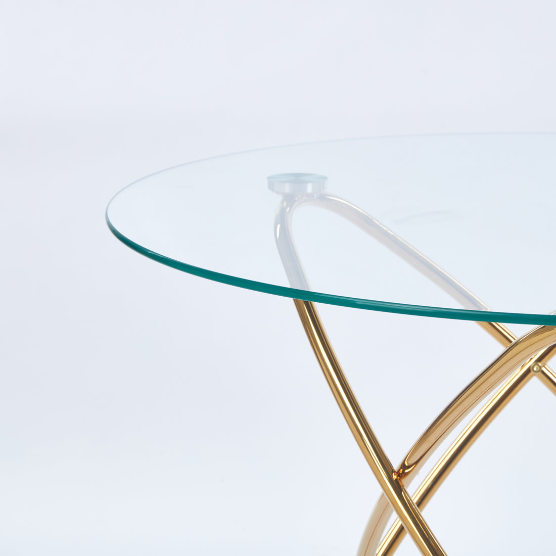 Adriatic gold dining table showing tempered glass top and metal joint detail