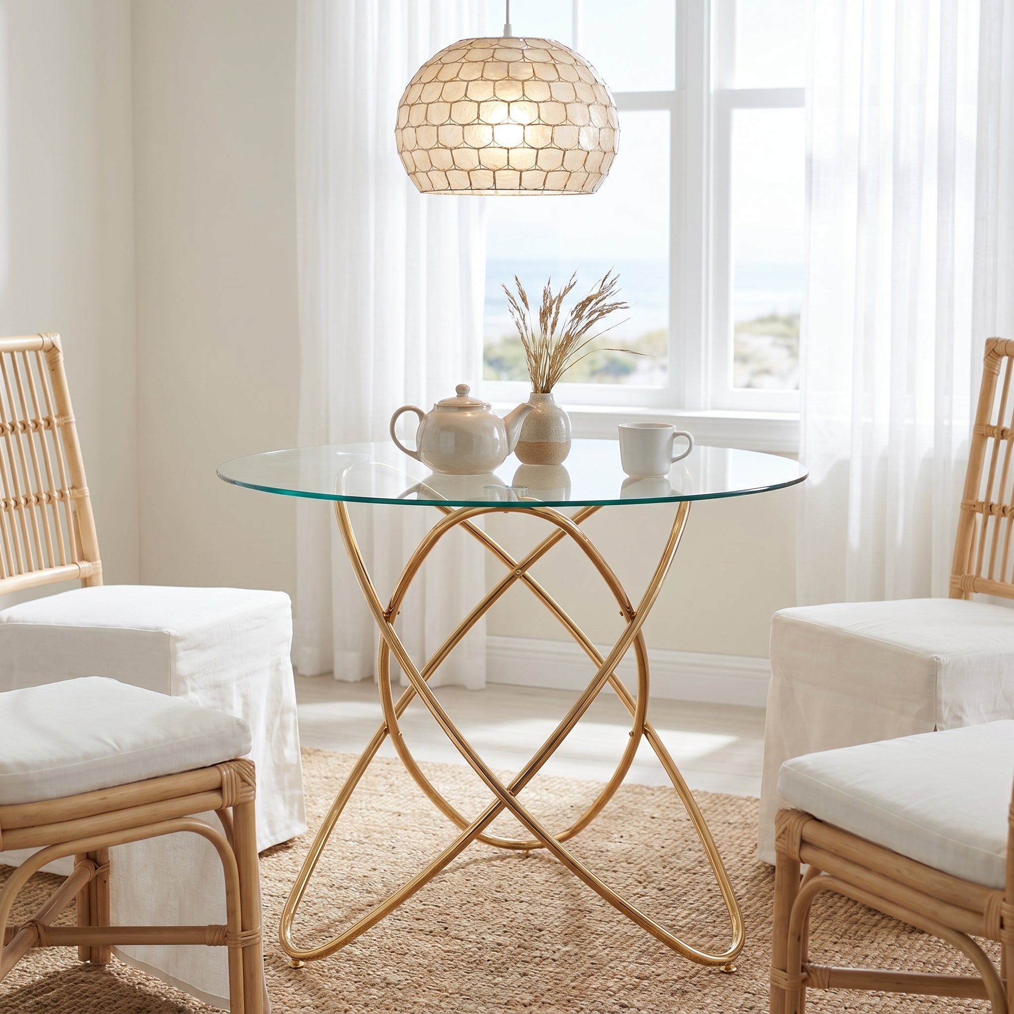 Adriatic gold dining table showing a round glass table in a bright dining space