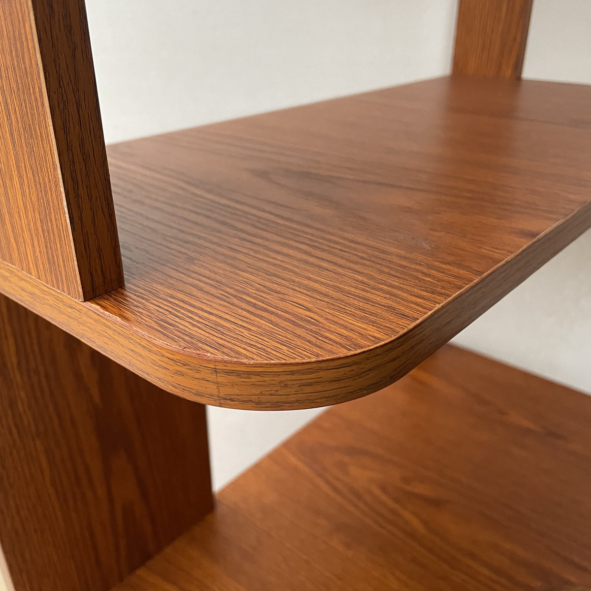 Agora oak corner bookshelf showing open shelf storage detail