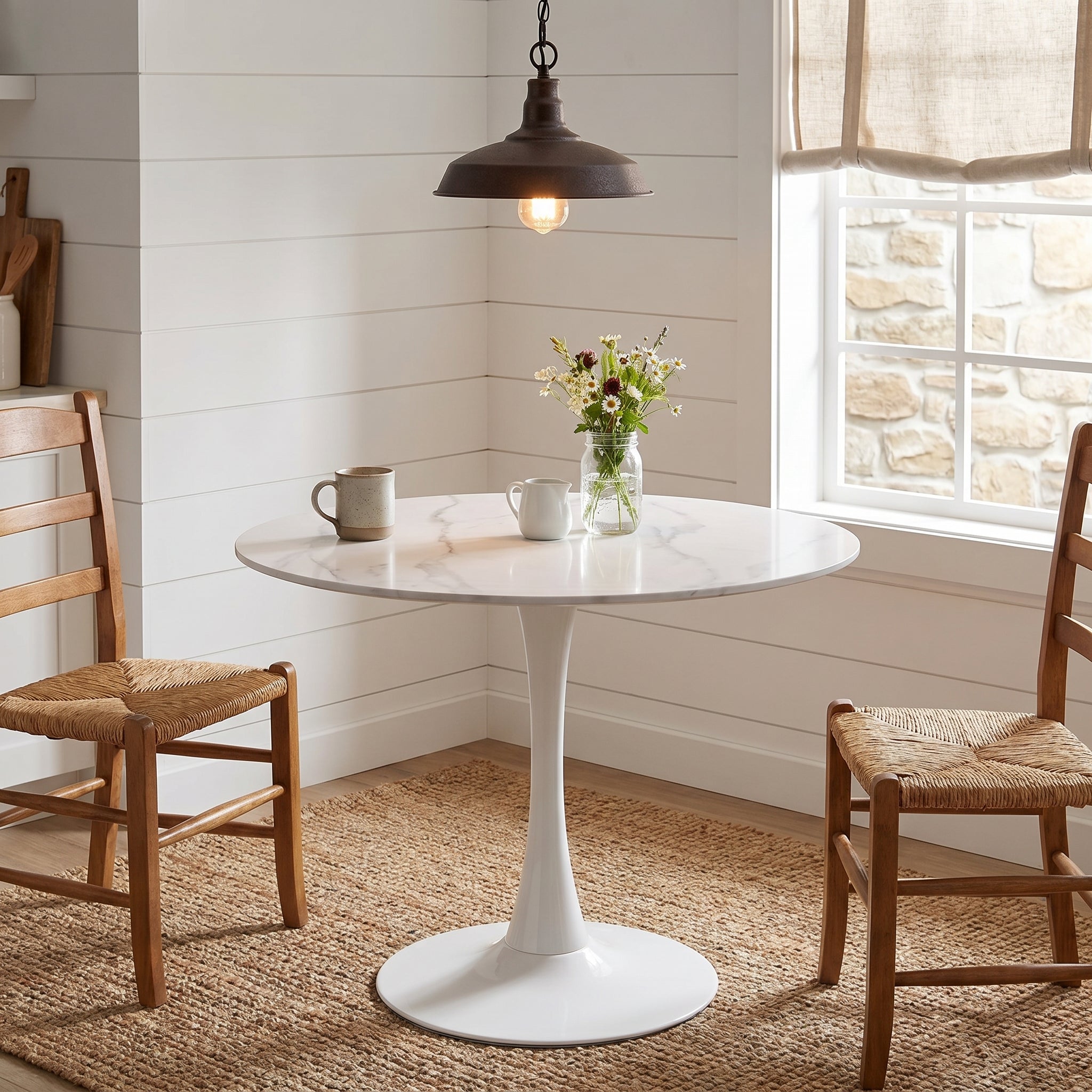 Alpine white dining table showing a round tulip table in a bright dining nook
