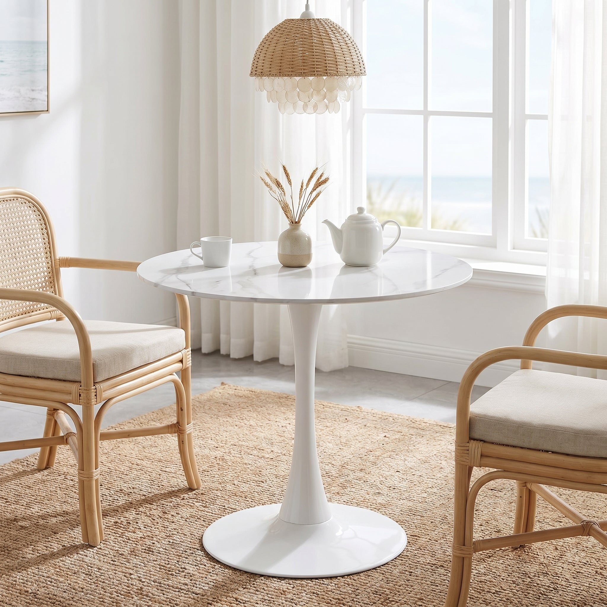 Alpine white dining table showing a round pedestal table in a bright room corner