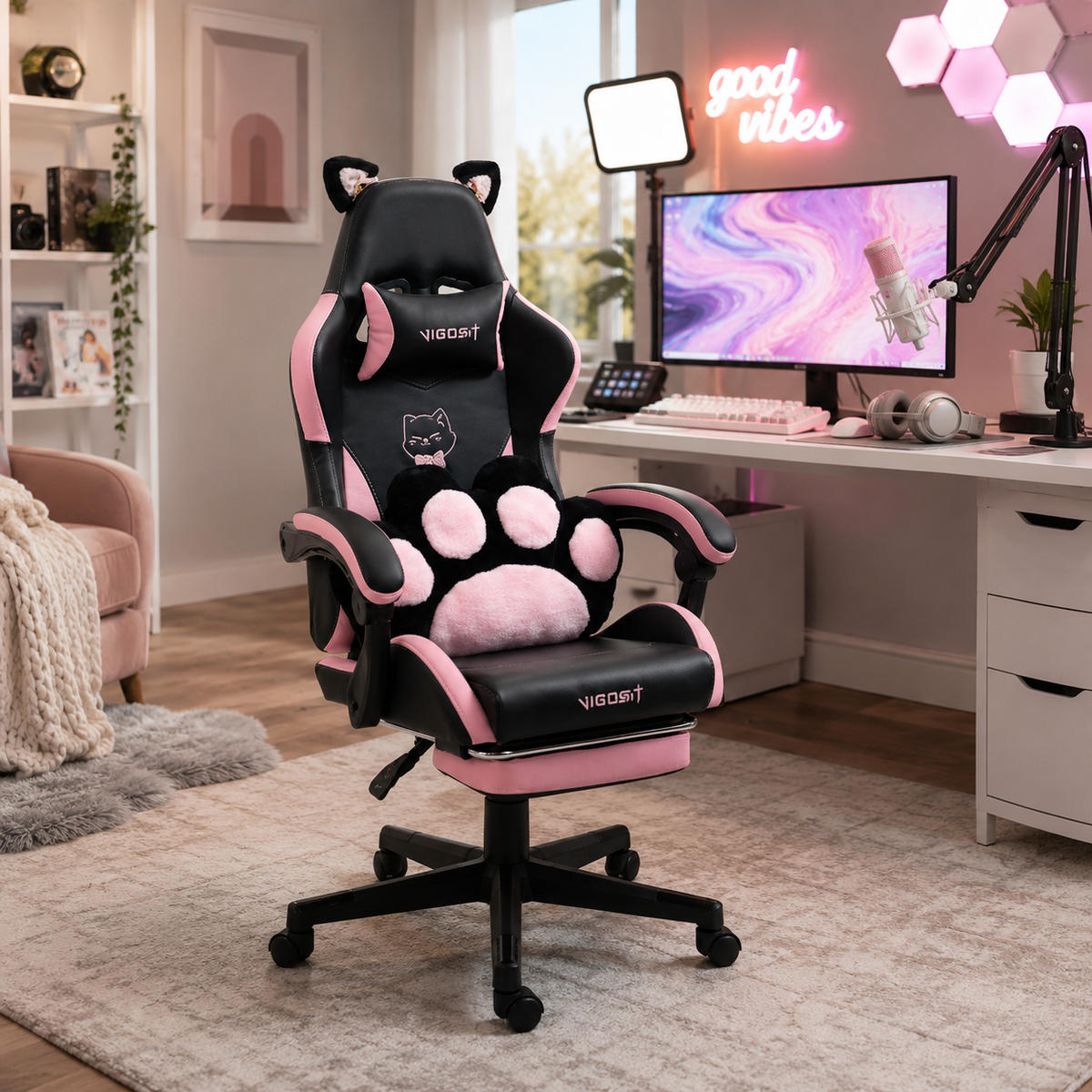 Altair black gaming chair with paw lumbar cushion in a room with pink and purple LED lighting