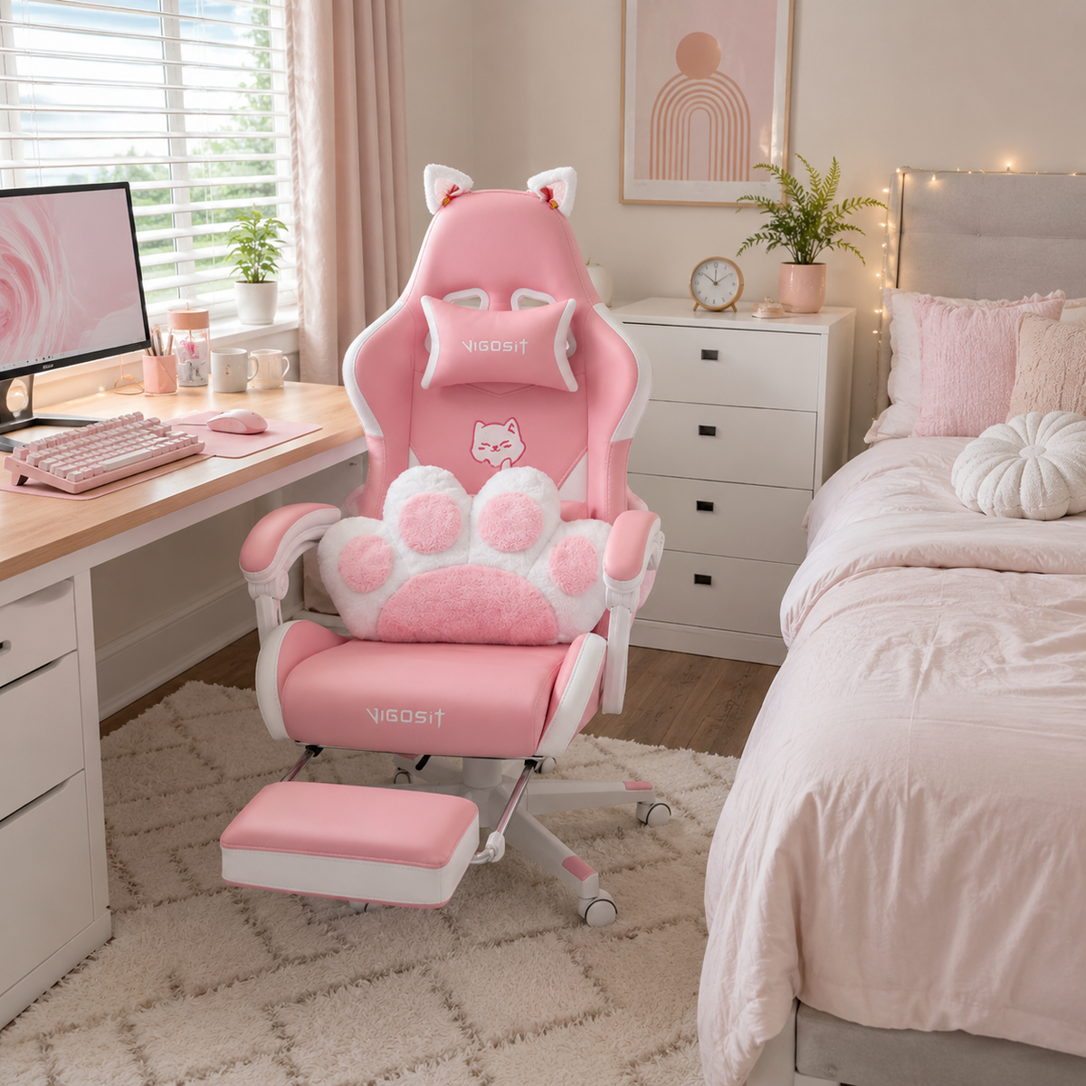 Altair pink gaming chair beside a white desk in a cozy bedroom gaming setup