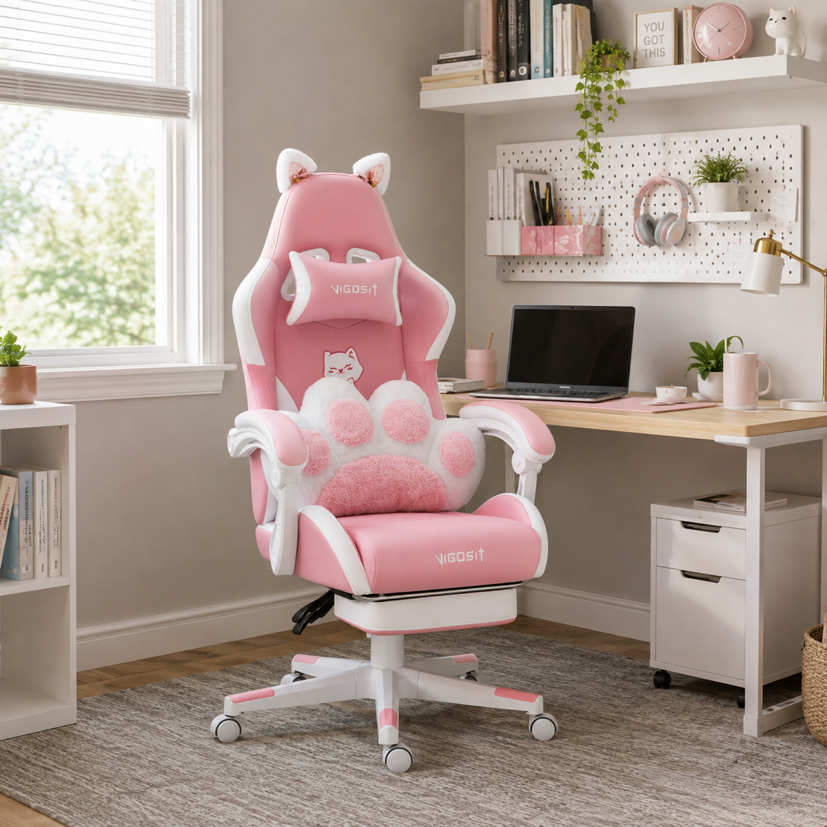 Altair pink reclining gaming chair with retractable footrest in a cute pastel workspace