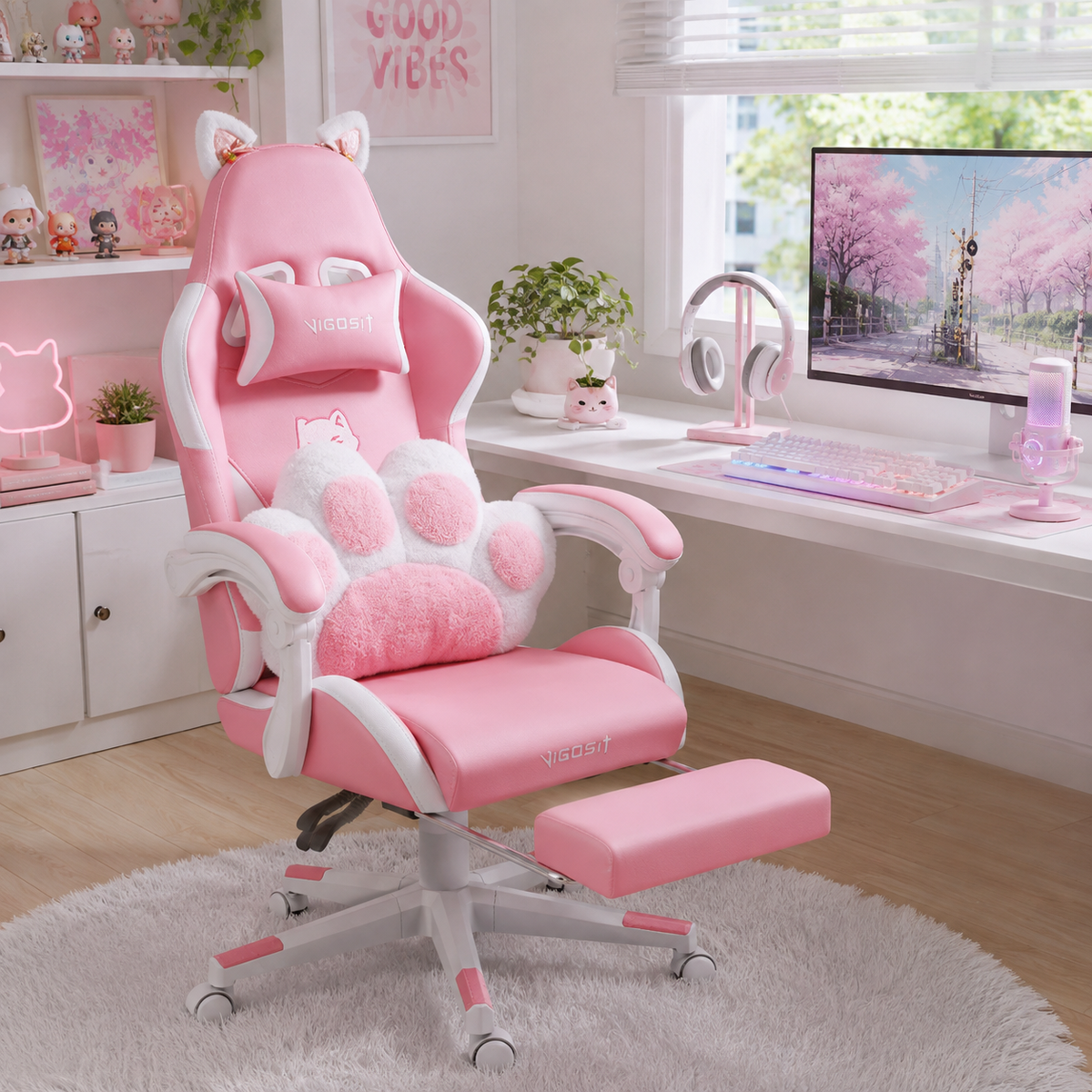 Altair pink cat ear gaming chair in a warm room with monitor and shelving
