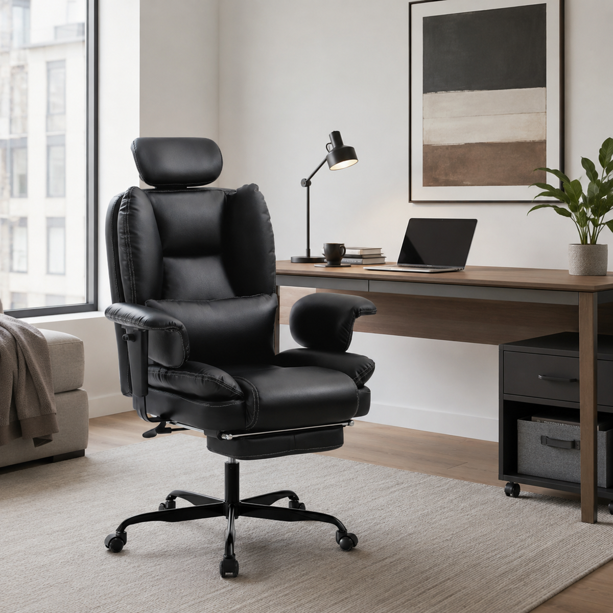 Alvik black office chair showing an ergonomic workstation beside a desk and computer monitor