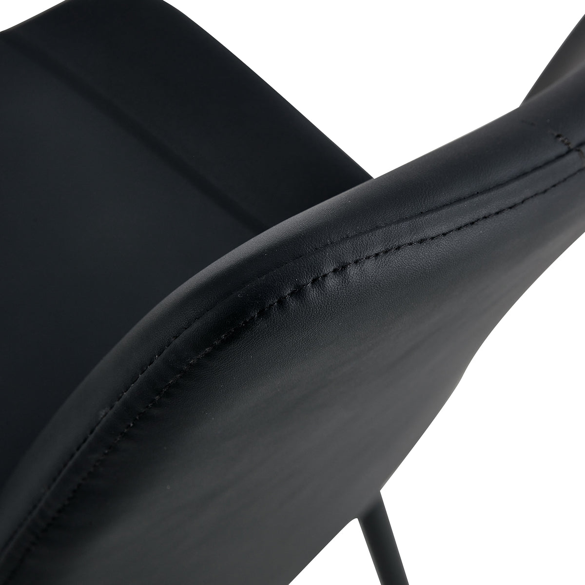Amalfi black dining chair close-up of the curved faux leather seat and backrest connection