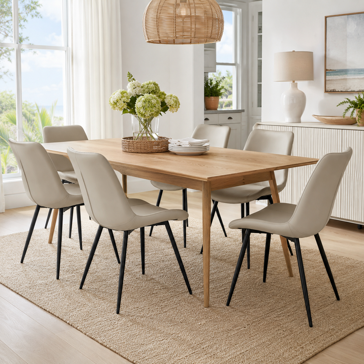Amalfi light grey faux leather dining chairs in a warm dining space with neutral decor