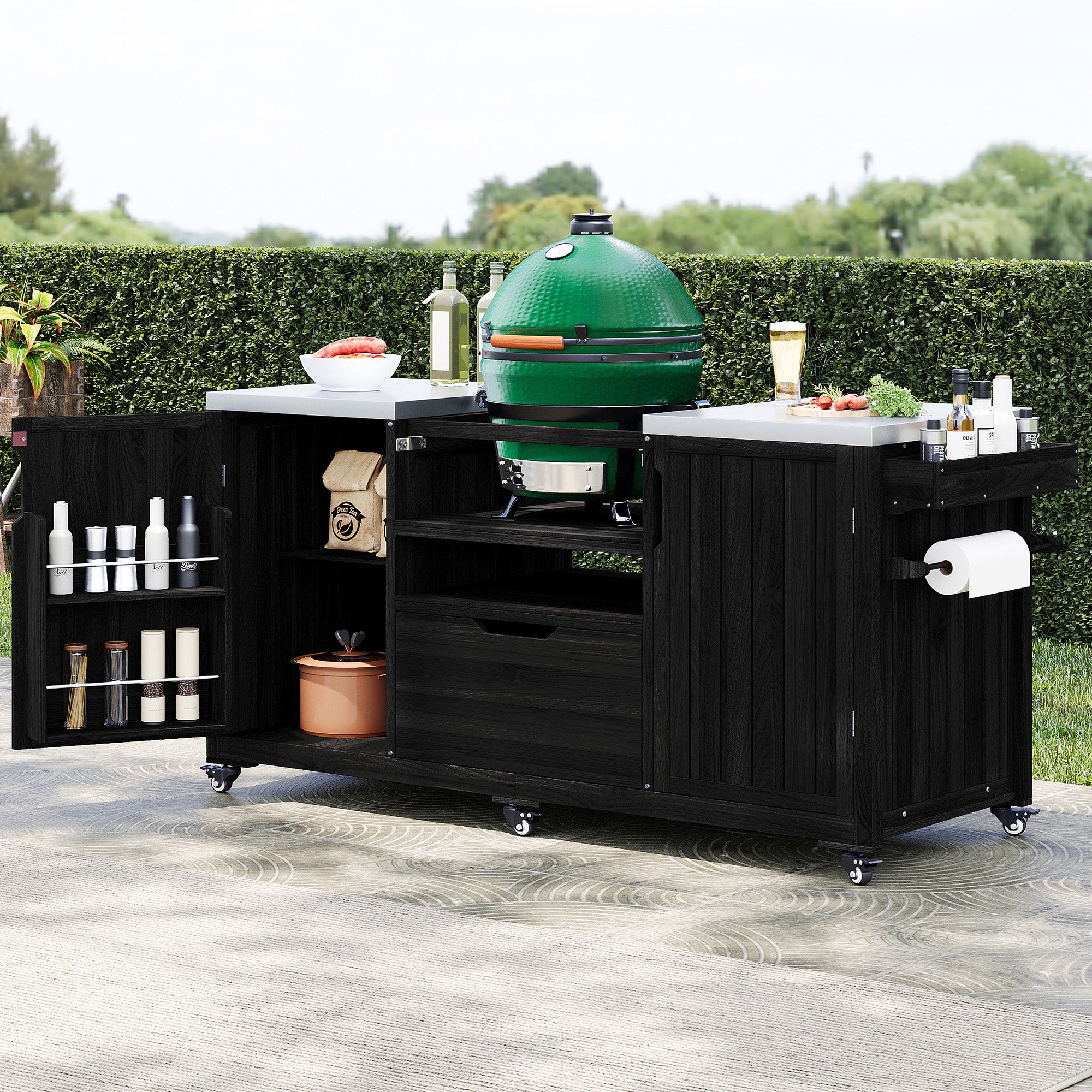 Antibes black outdoor kitchen island showing kamado grill installation open storage shelves spice racks paper towel holder and outdoor BBQ preparation area