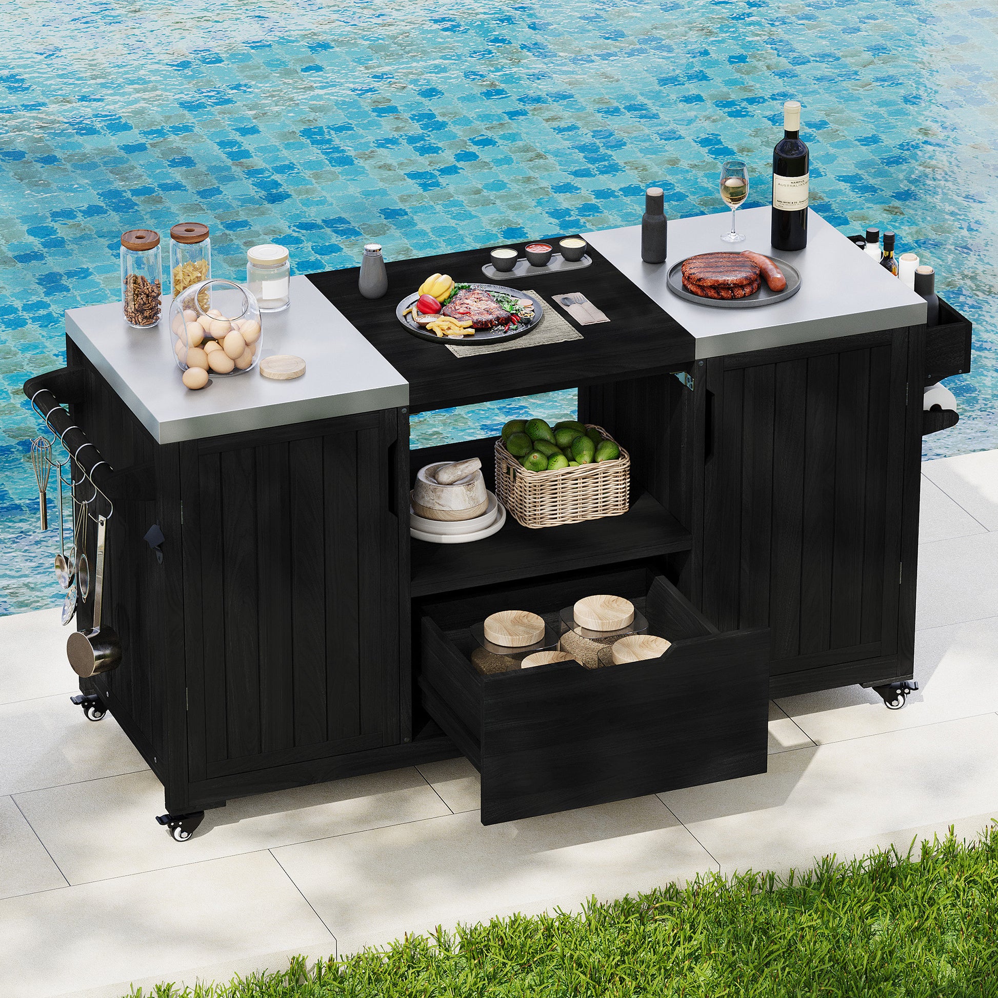 Antibes black outdoor kitchen island showing stainless steel countertops grill-ready center opening storage shelf and drawer beside poolside entertaining area