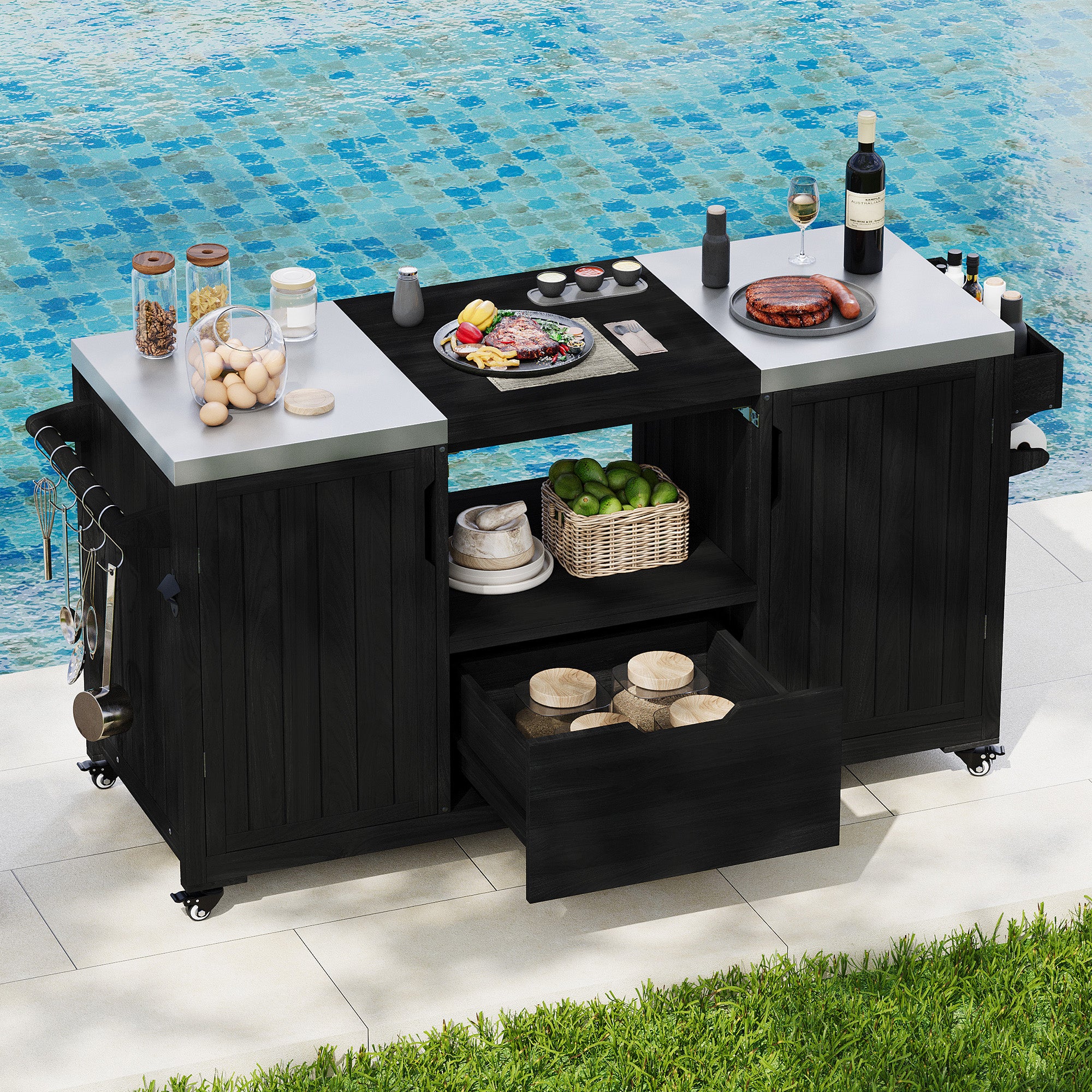 Antibes black outdoor kitchen island showing stainless steel countertops grill-ready center opening storage shelf and drawer beside poolside entertaining area
