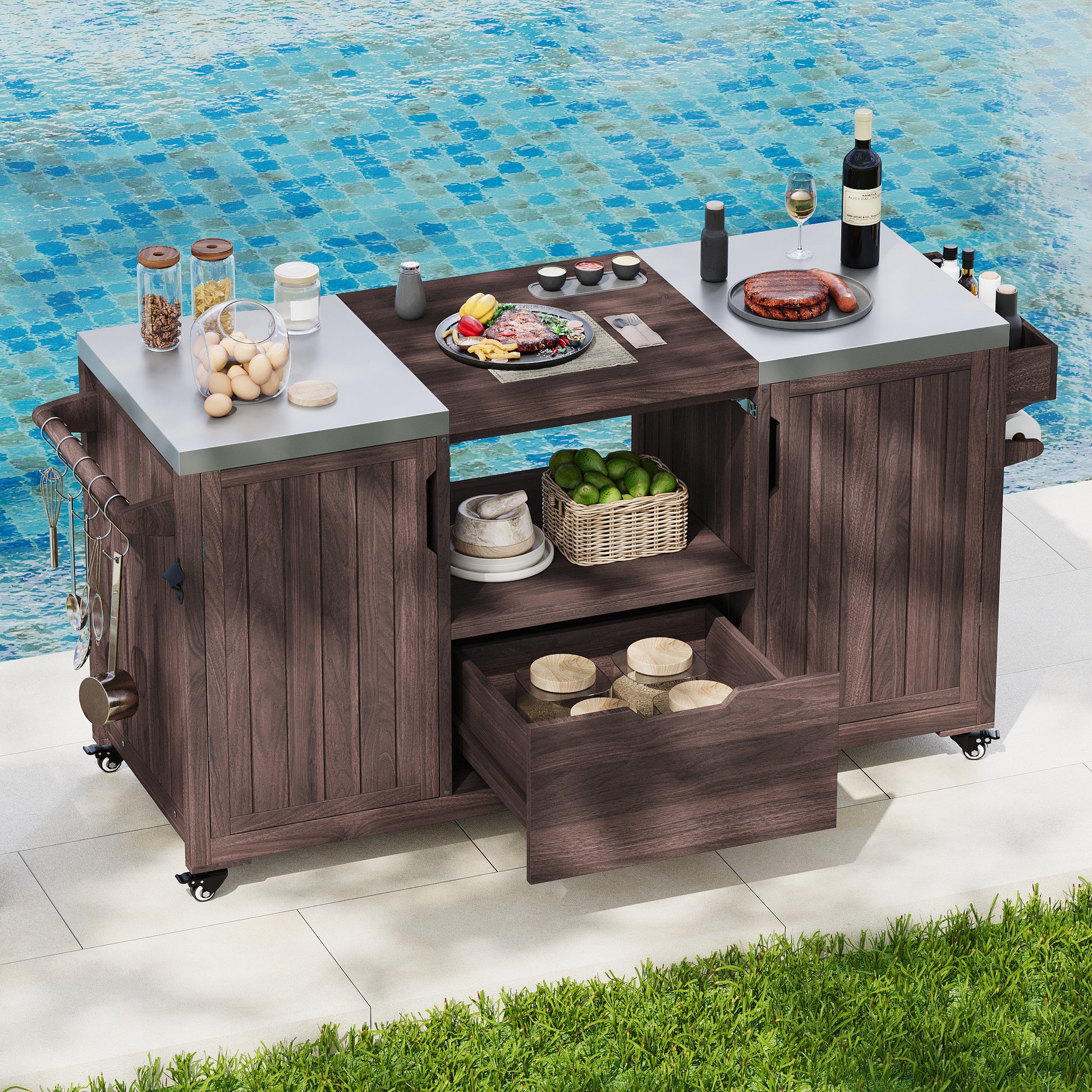 Antibes dark brown outdoor kitchen island showing stainless steel countertops grill-ready center opening storage shelf and drawer beside poolside entertaining area