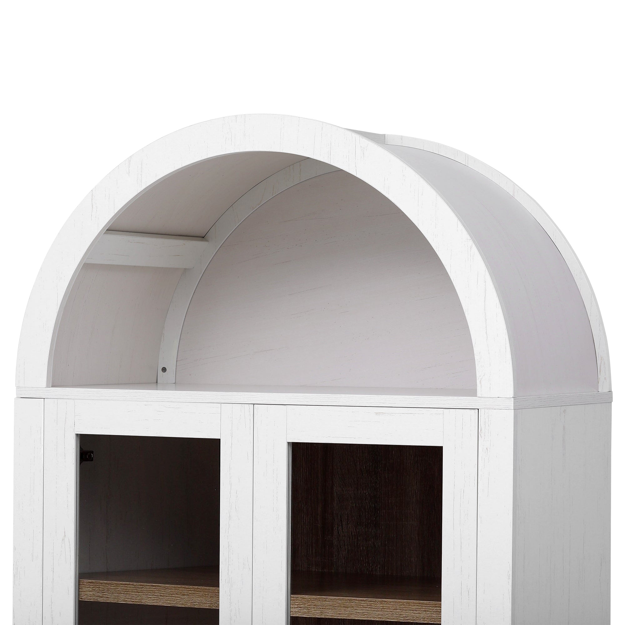 Close-up view of the Artisan white pantry cabinet featuring a curved arched top design with farmhouse-inspired wood texture and glass door storage below