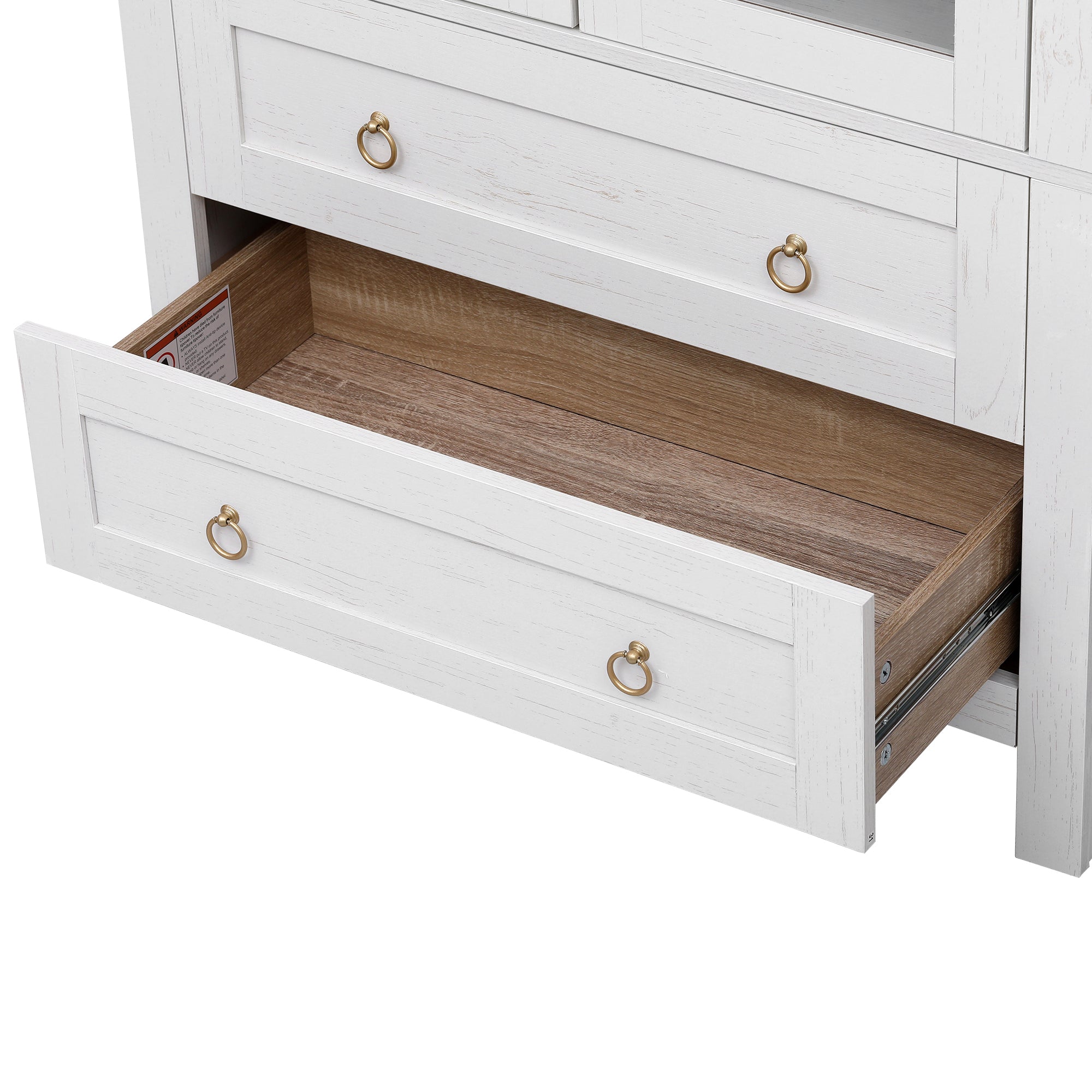 Close-up of the open lower storage drawer on the white Artisan pantry cabinet featuring spacious wood-tone interior and gold ring pull hardware