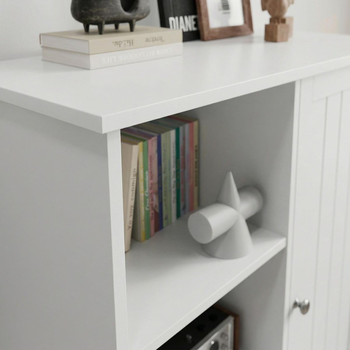 Barcelona white storage cabinet showing open shelf storage with styled top detail