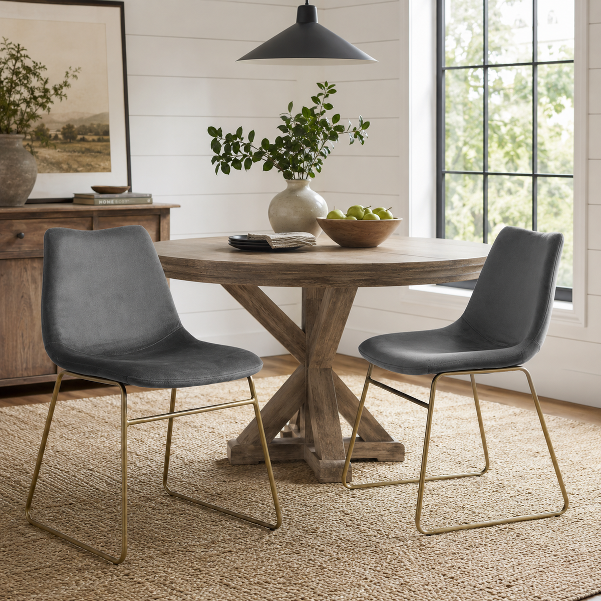 Batassel grey velvet dining chairs with gold metal base beside a wood dining table