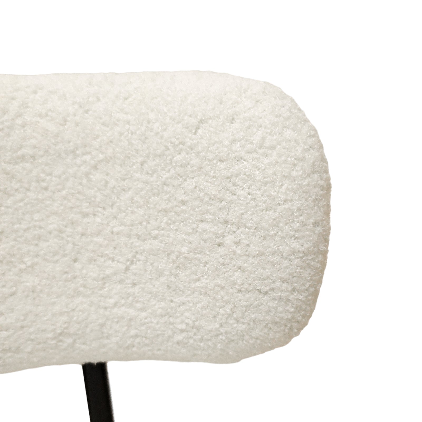 Bled white dining chair close-up of the textured upholstered seat cushion