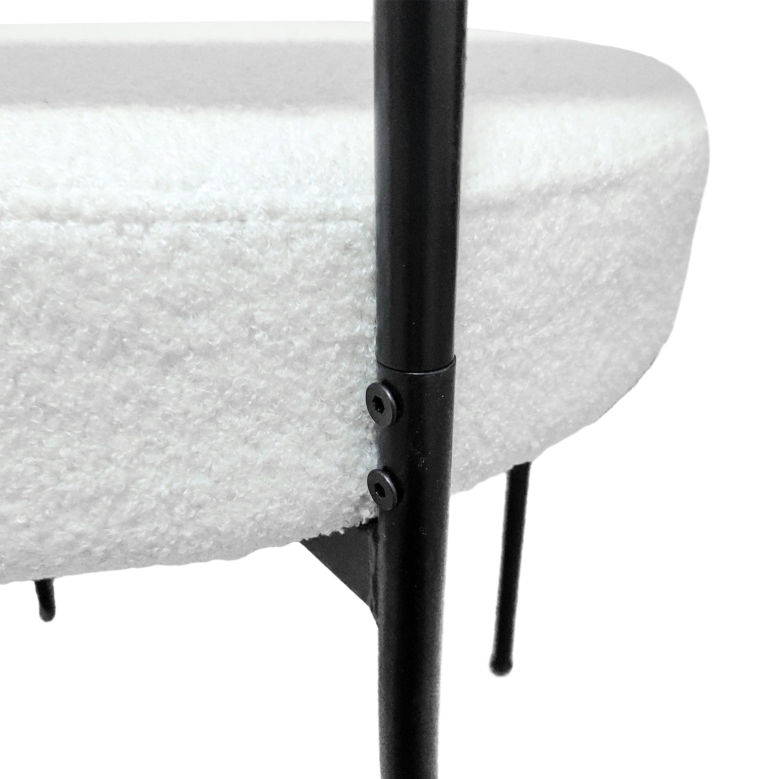 Bled white dining chair close-up of the back upholstery and black metal leg connection