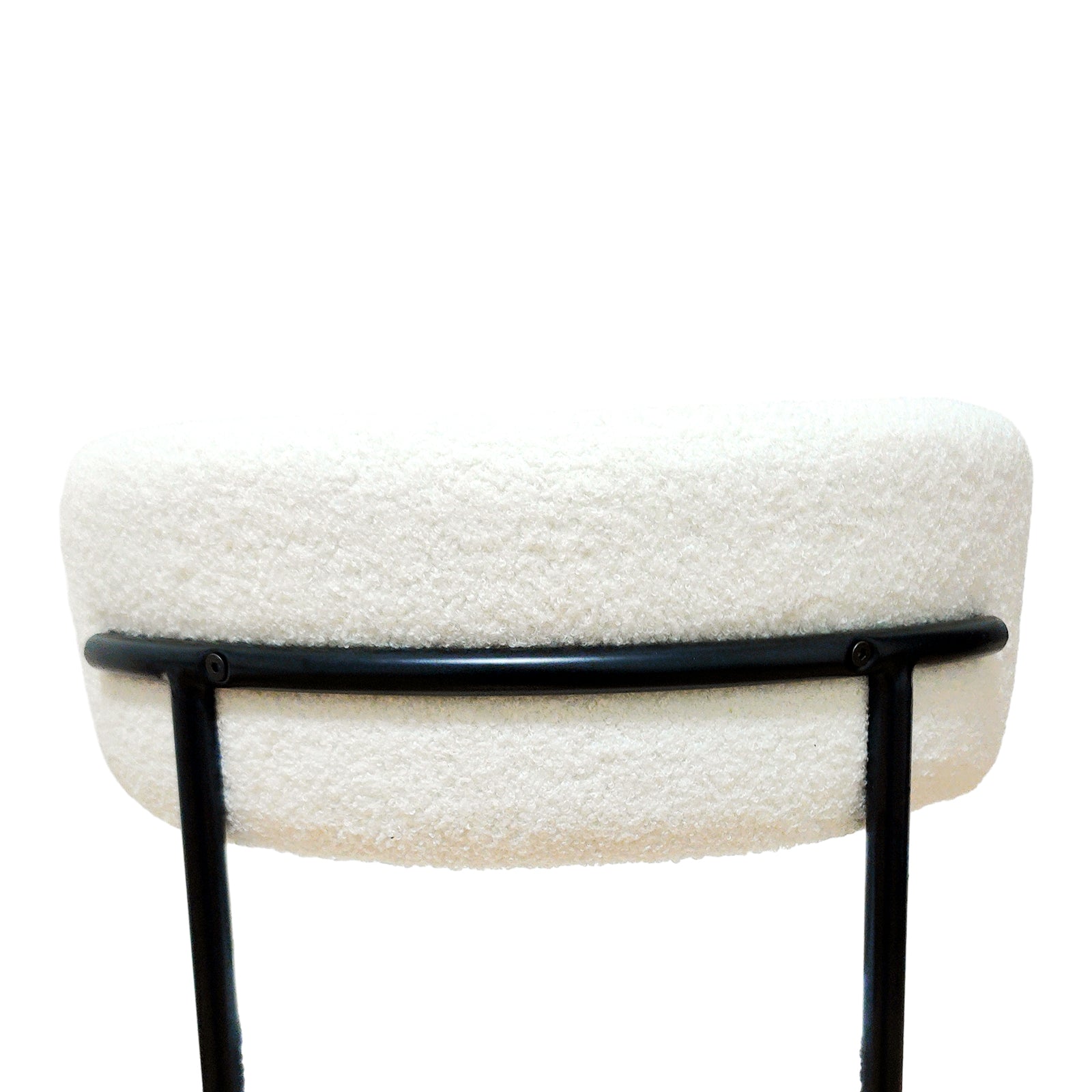 Bled white dining chair close-up of the seat edge and black metal support frame