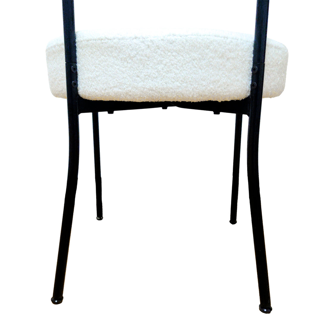 Bled white dining chair rear view showing the curved upholstered back and slim black legs