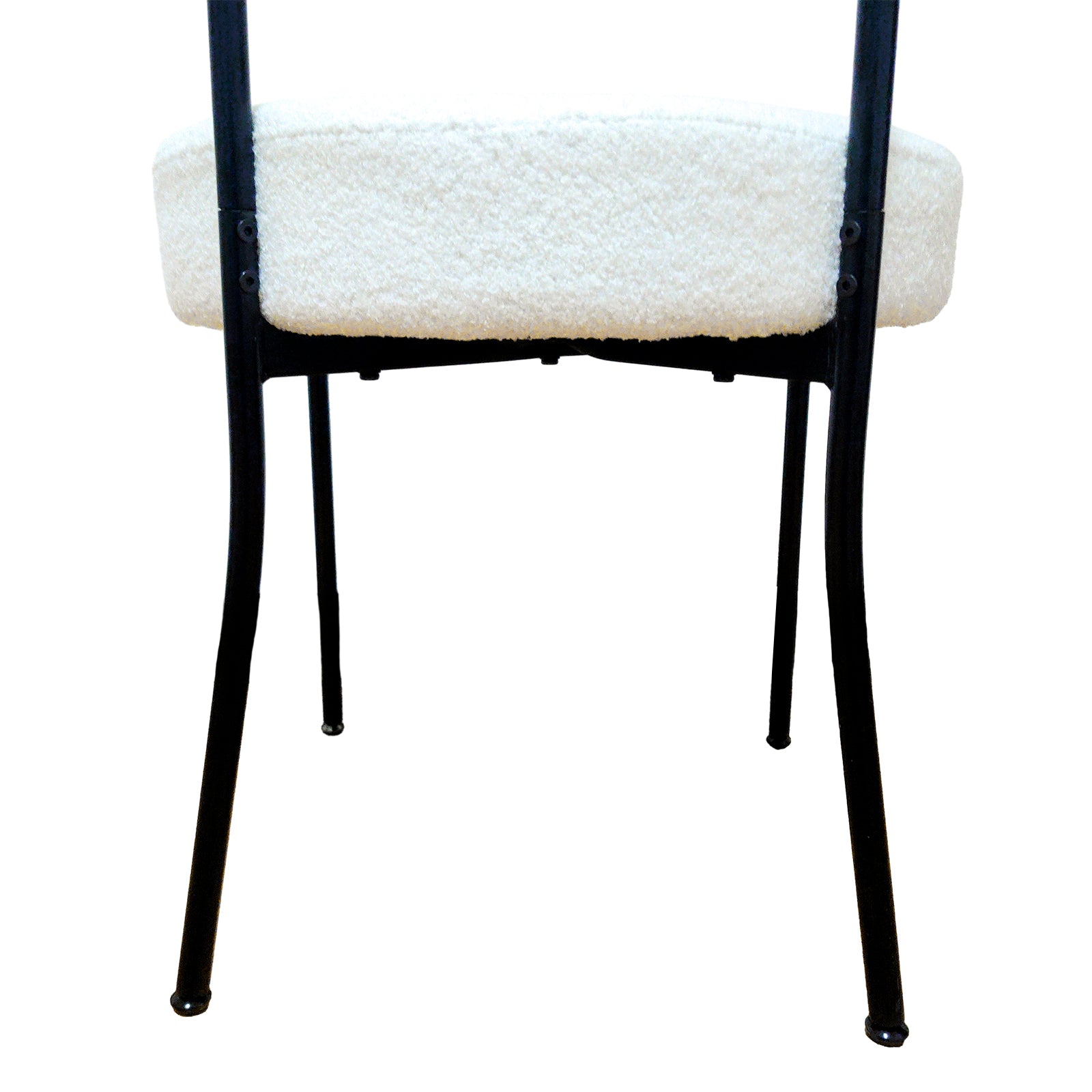 Bled white dining chair rear view showing the curved upholstered back and slim black legs