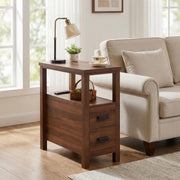 Branford walnut end table showing angled front view beside a sofa