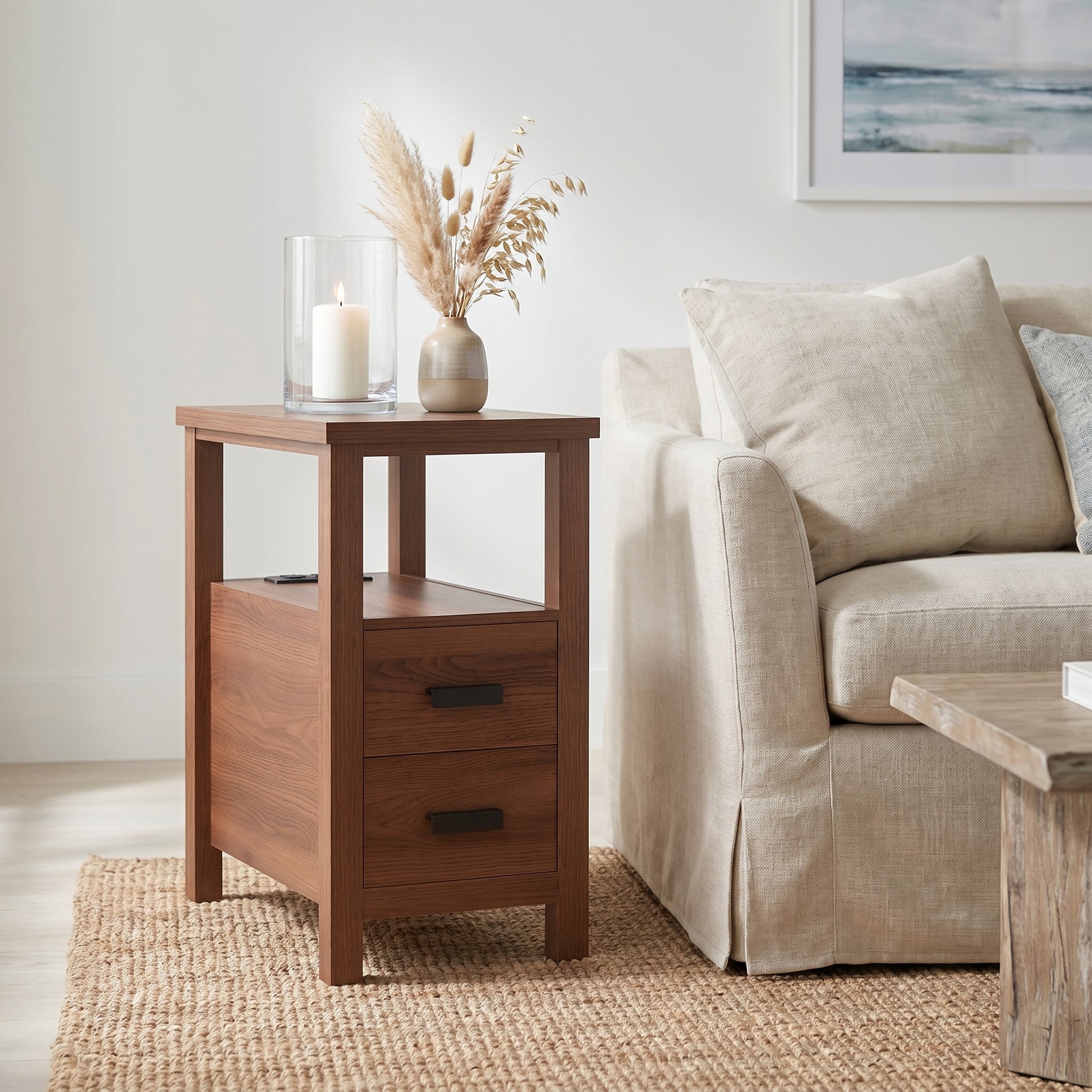 Branford walnut end table showing angled front view beside a sofa