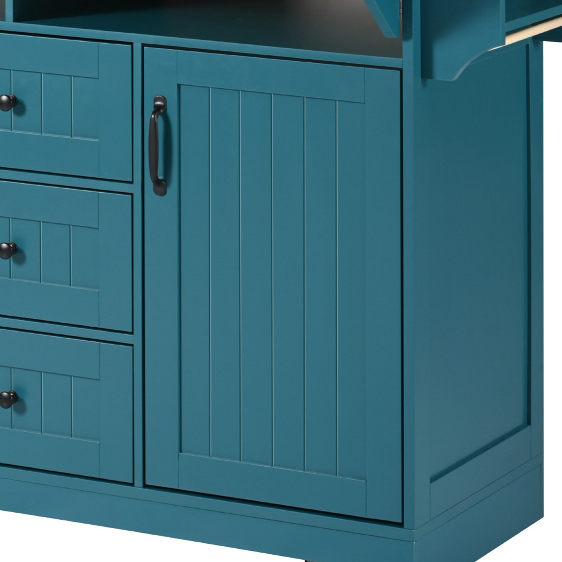 Close-up detail of the green BRYNNA kitchen island featuring farmhouse-style paneled cabinet door design with matte black metal handle and textured finish