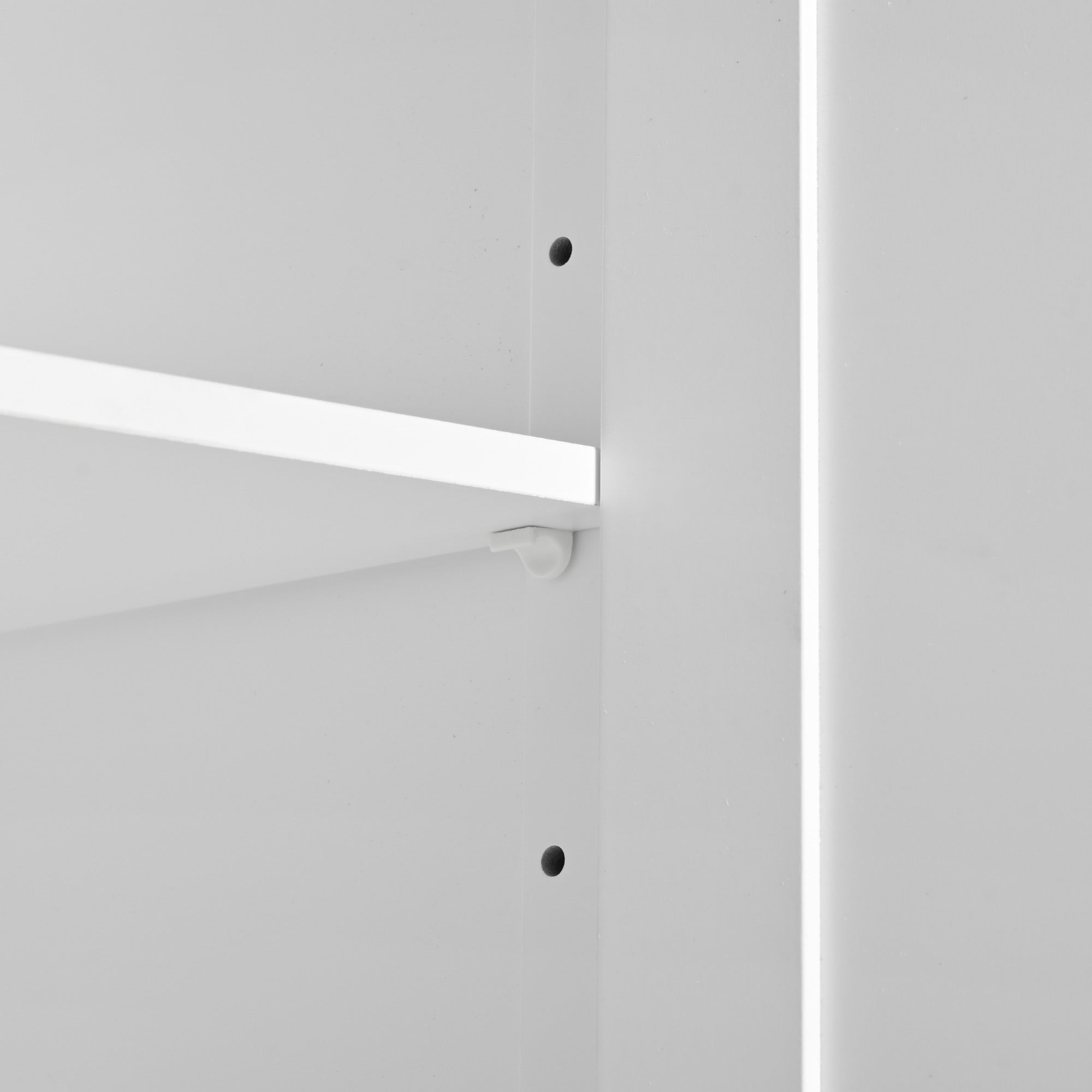 Close-up of the white BRYNNA kitchen island adjustable interior shelf with multiple height positions for customizable kitchen storage organization
