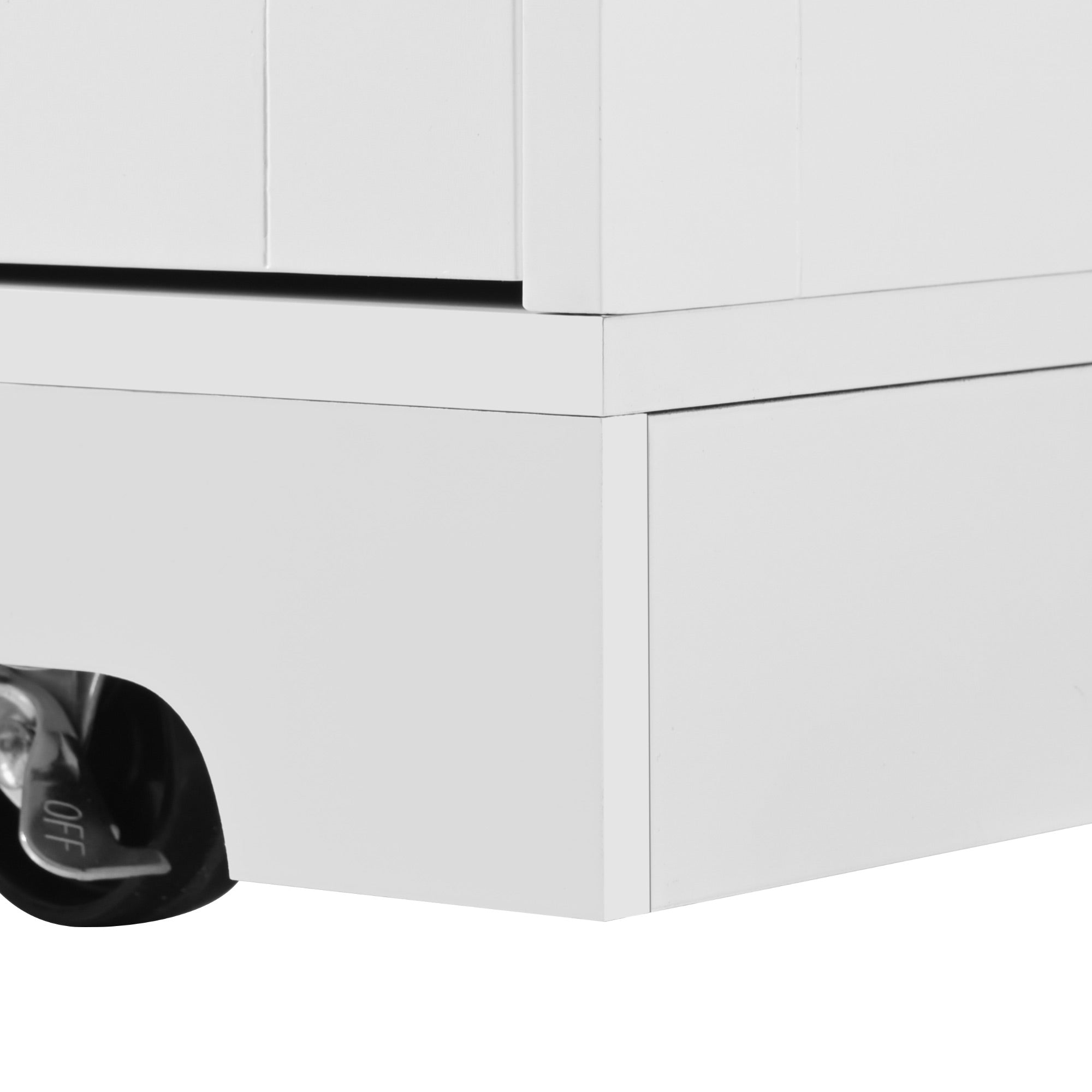 Close-up of the white BRYNNA kitchen island base with recessed toe kick and hidden locking caster wheel for smooth mobility and stable positioning