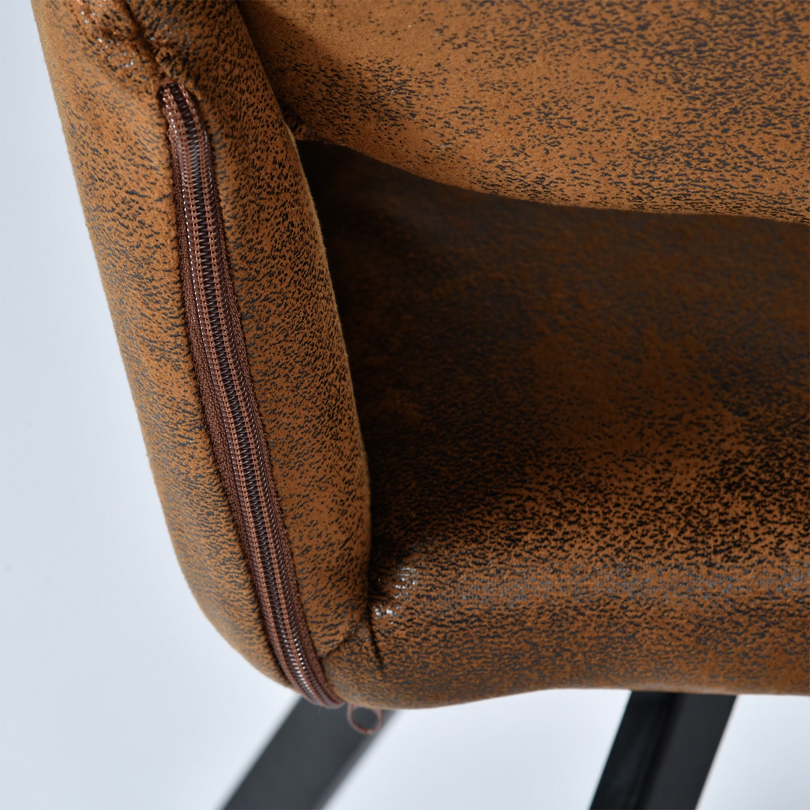 California suede brown swivel dining chair showing back upholstery seam detail