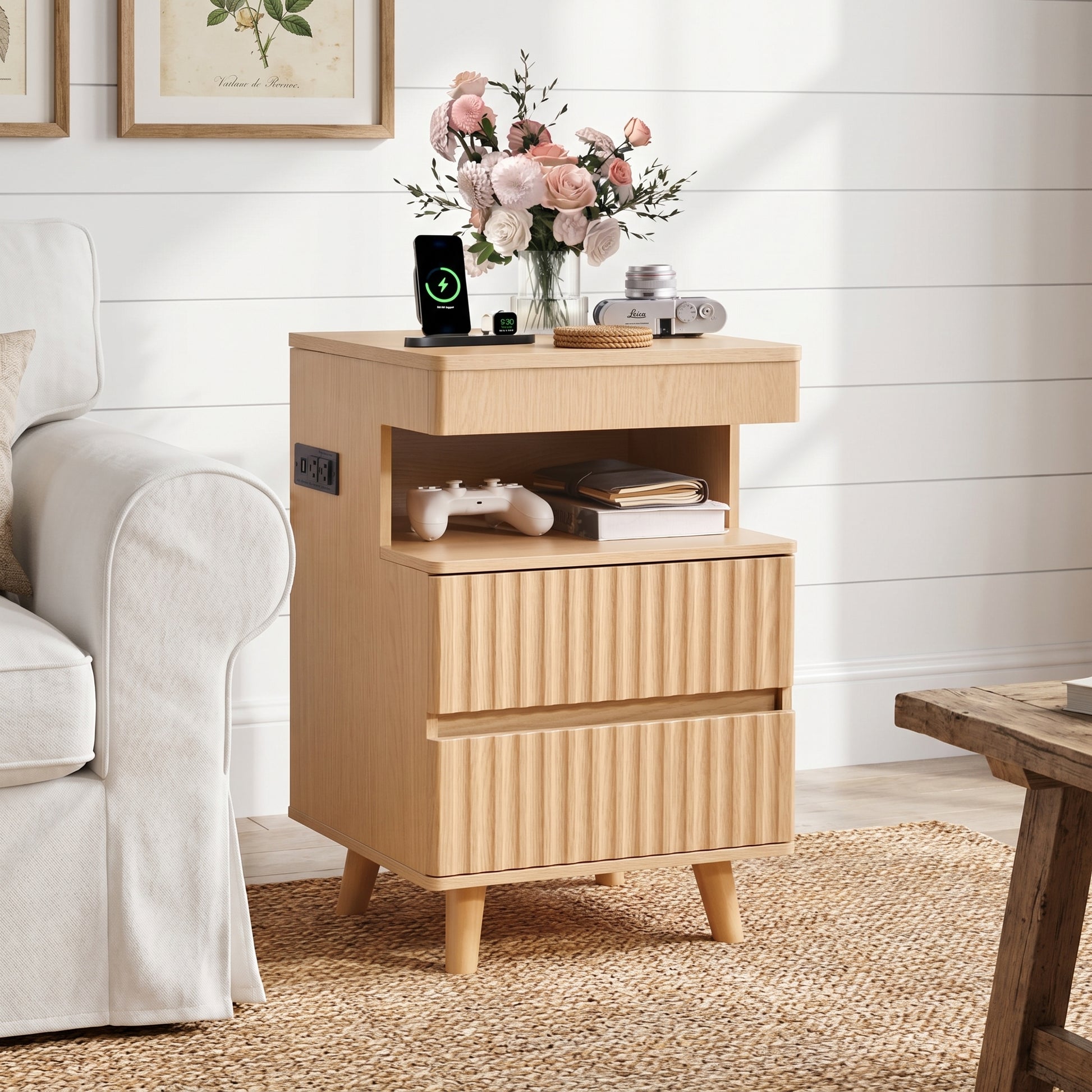 Calven oak nightstand showing angled front view beside a sofa