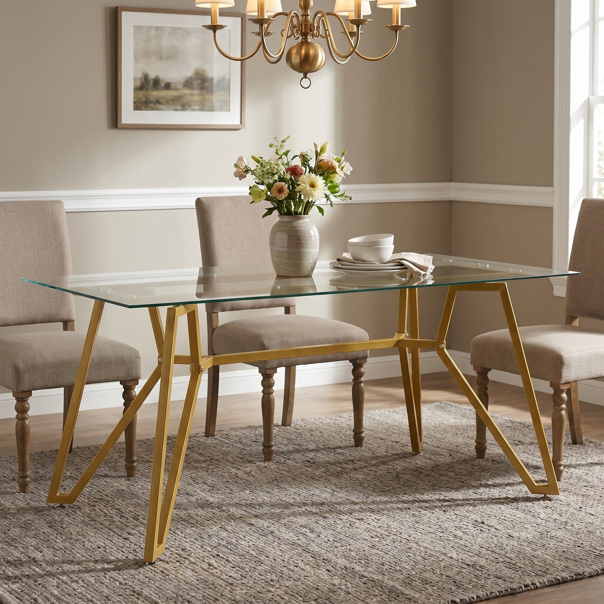 Caspian gold dining table showing a modern dining setup with upholstered chairs and wall art
