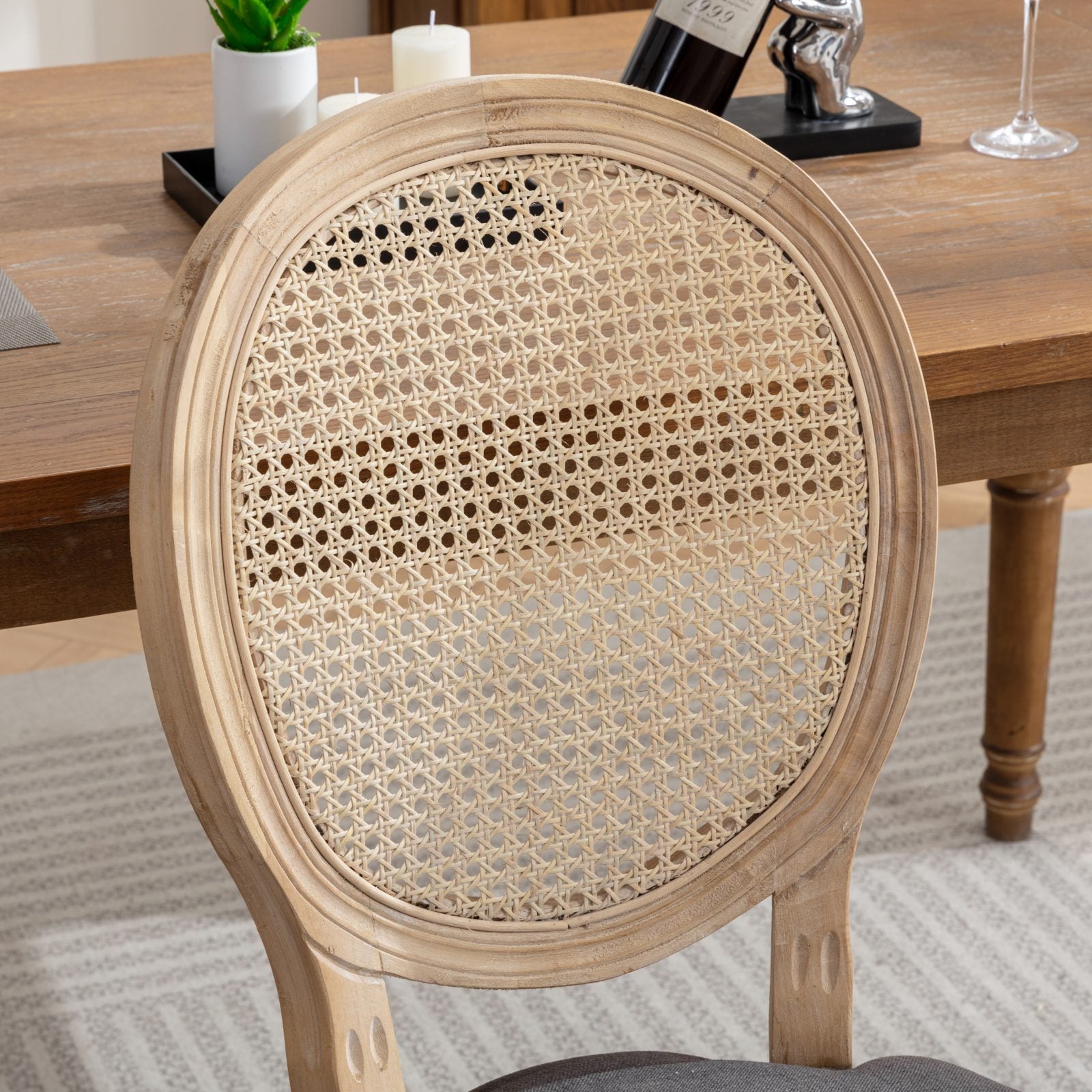 Celeste gray dining chair close-up of the upholstered seat and natural wood frame