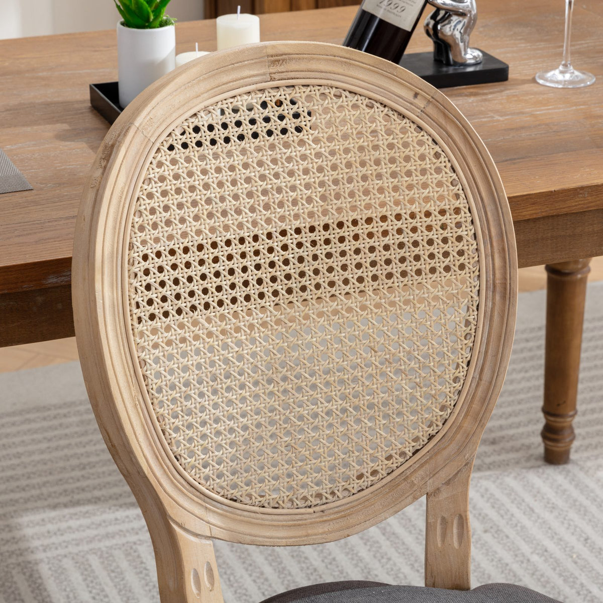 Celeste gray dining chair close-up of the upholstered seat and natural wood frame