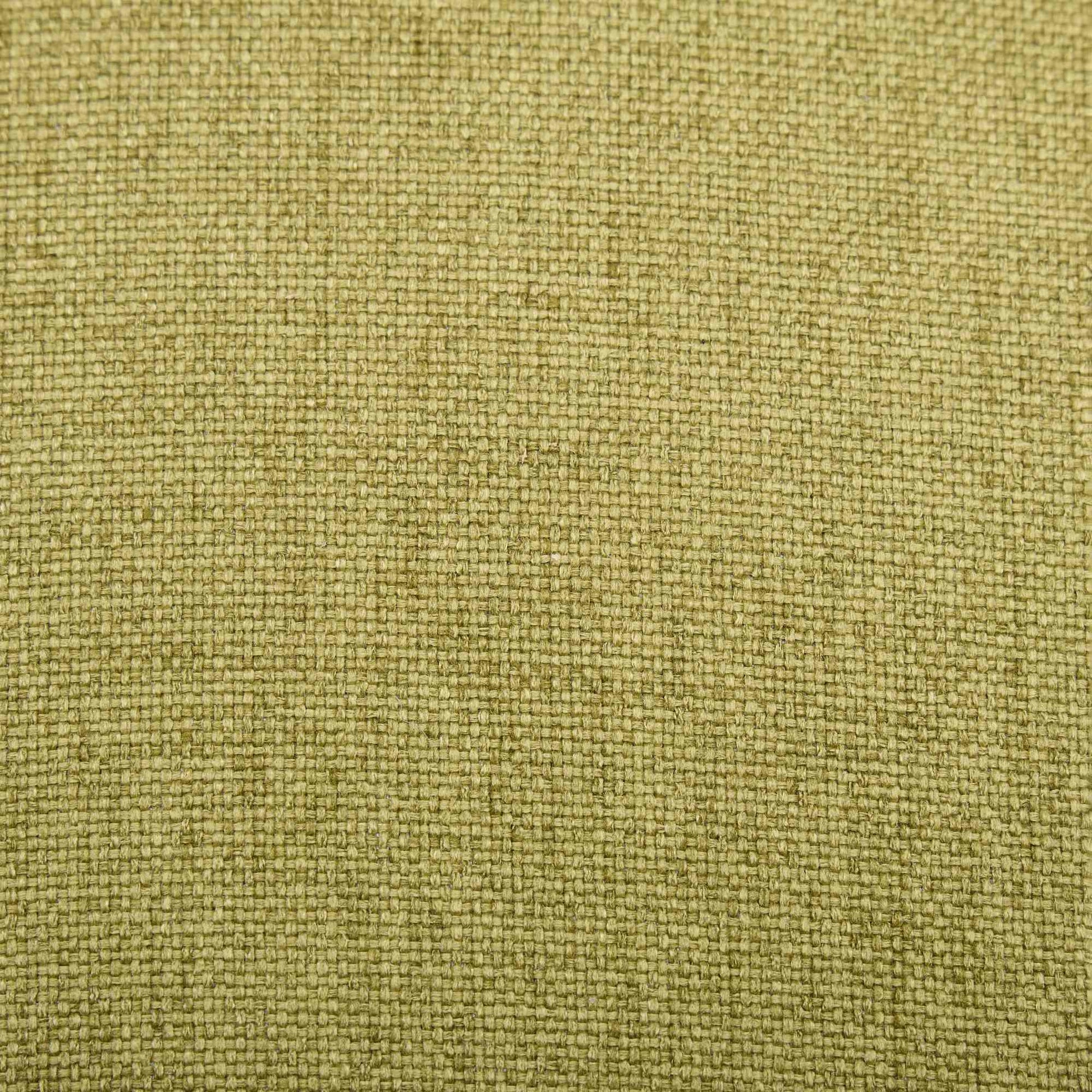 Celeste green dining chair close-up of the woven cane medallion back