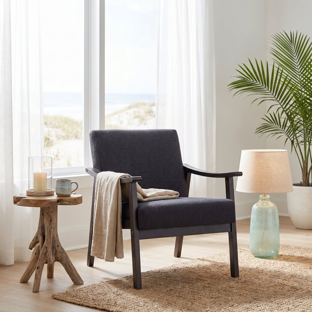 Champlain black accent chair showing a cozy seating corner with plant and decor