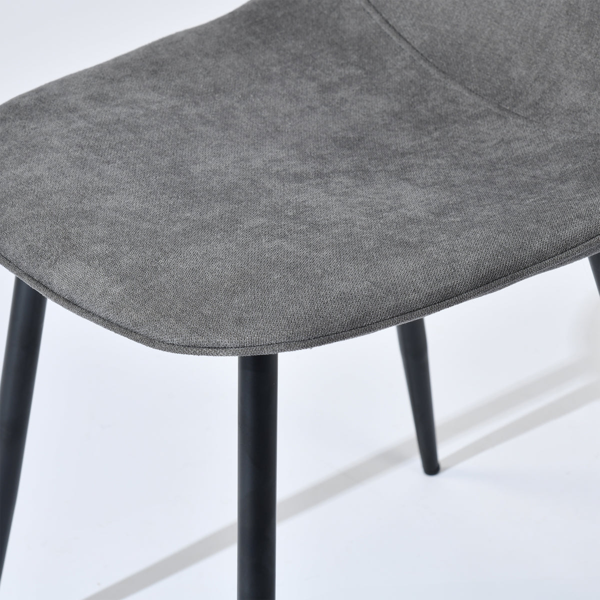 Charlton grey terry fabric shell dining chair showing padded seat and leg connection detail