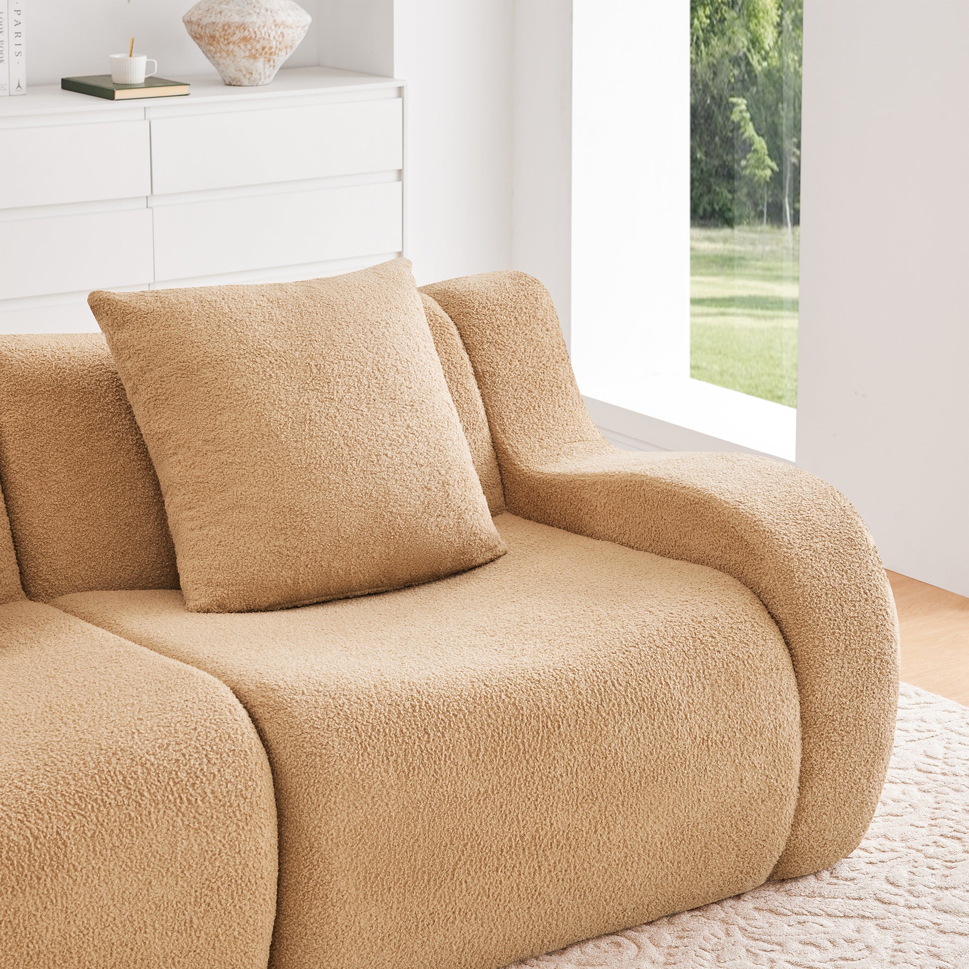 Chico camel teddy fabric sectional sofa curved armrest and seat cushion detail