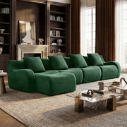 Chico green modular L-shaped sectional sofa with ottoman in modern living room with bookshelf