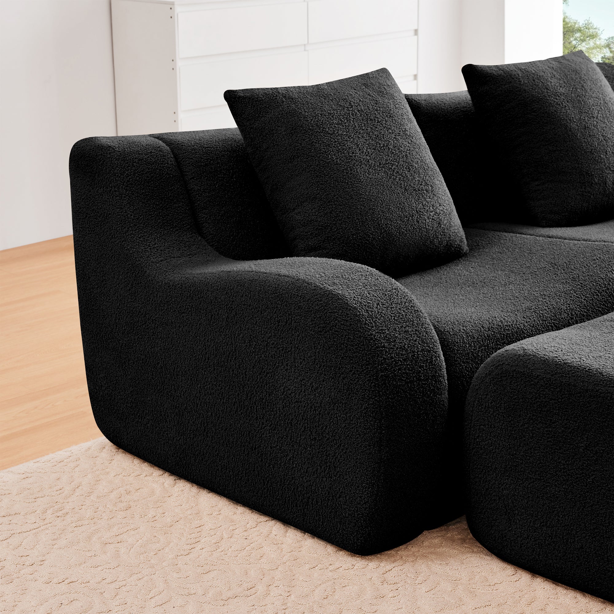 Chico black loveseat sofa curved armrest and cushion detail in soft teddy fabric