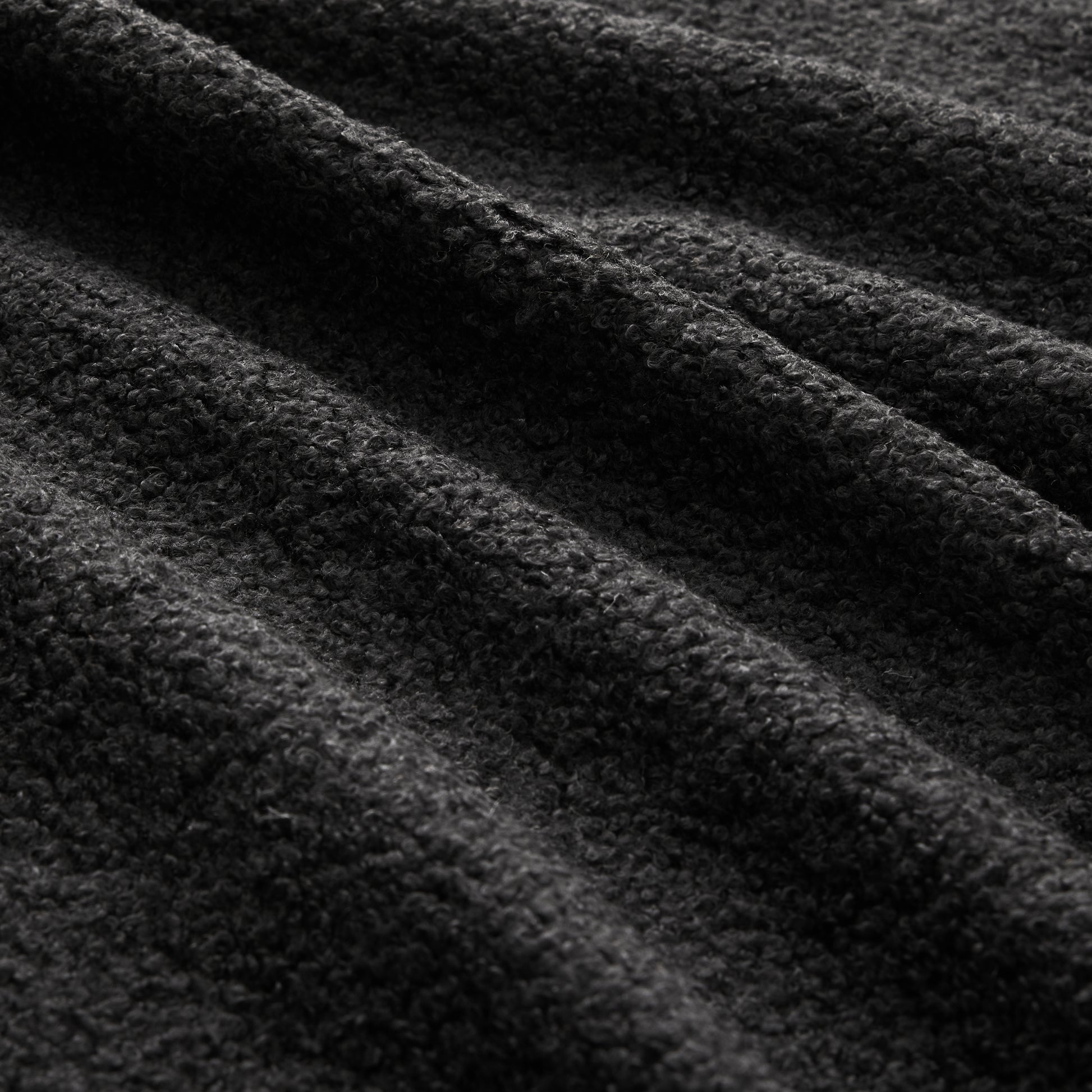 Chico black loveseat sofa soft teddy fabric texture close-up detail