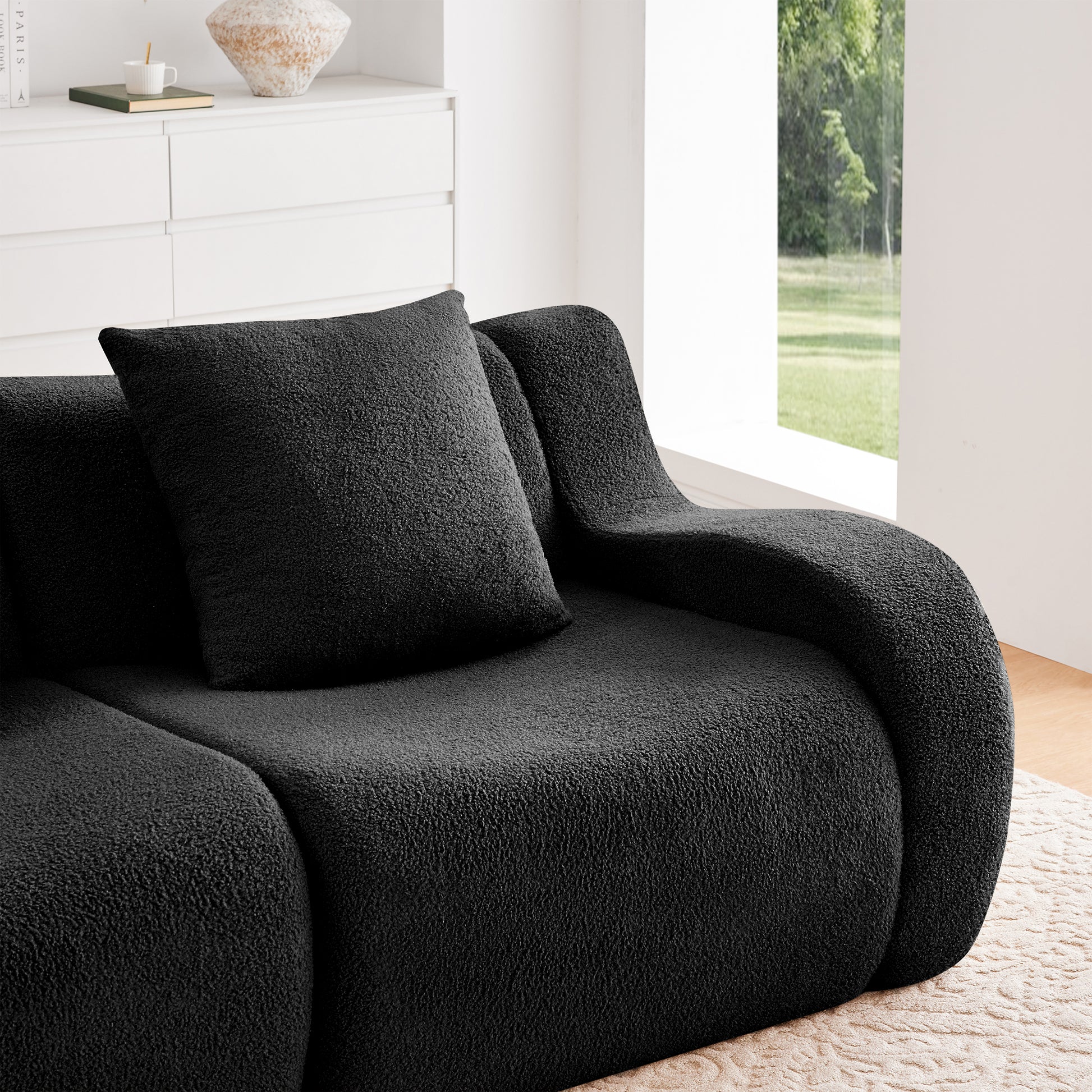 Chico black loveseat sofa seat cushion and armrest close-up detail