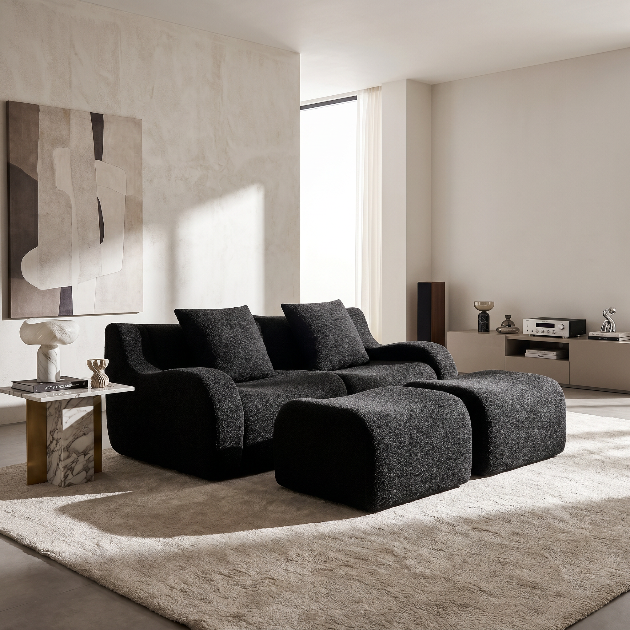 Chico black loveseat sofa in modern living room with neutral decor and large windows